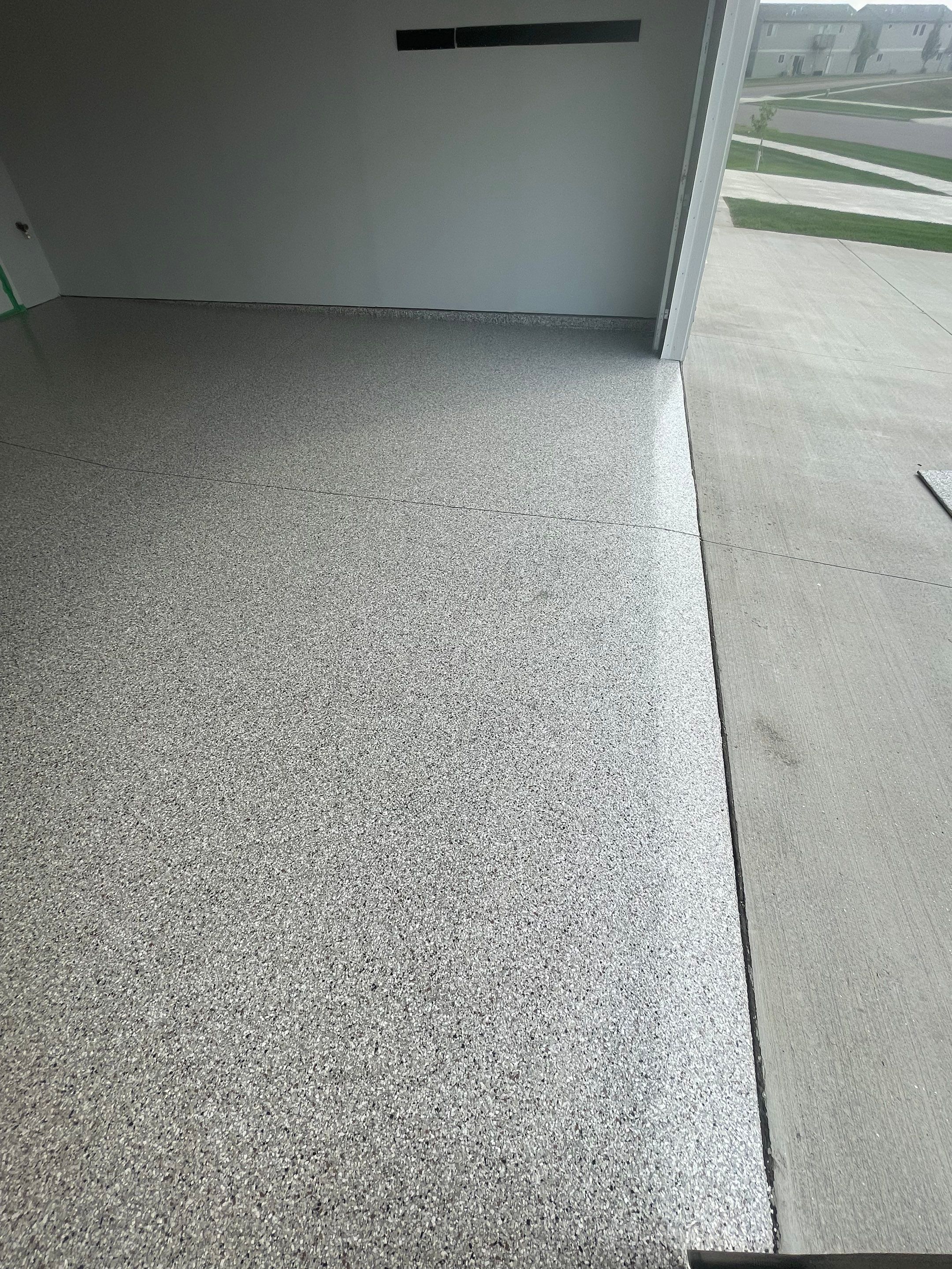 Custom Coyote Flake Garage Floor Coating in Sioux Falls by Select Painting, Coatings & Garage Cabinets