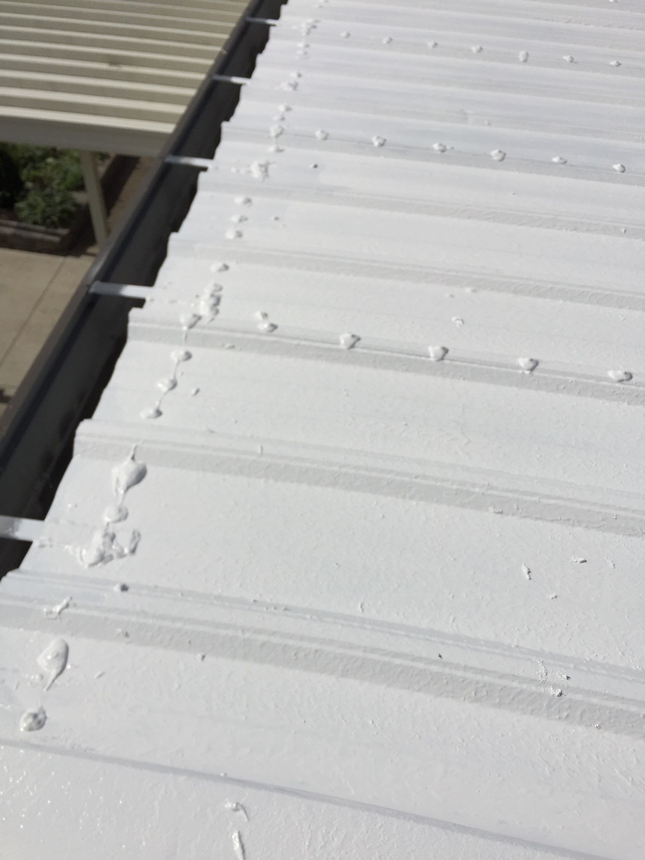 Commercial Roof Coating using Gaco Silicone Roof Coating by Secure Construction Company Inc