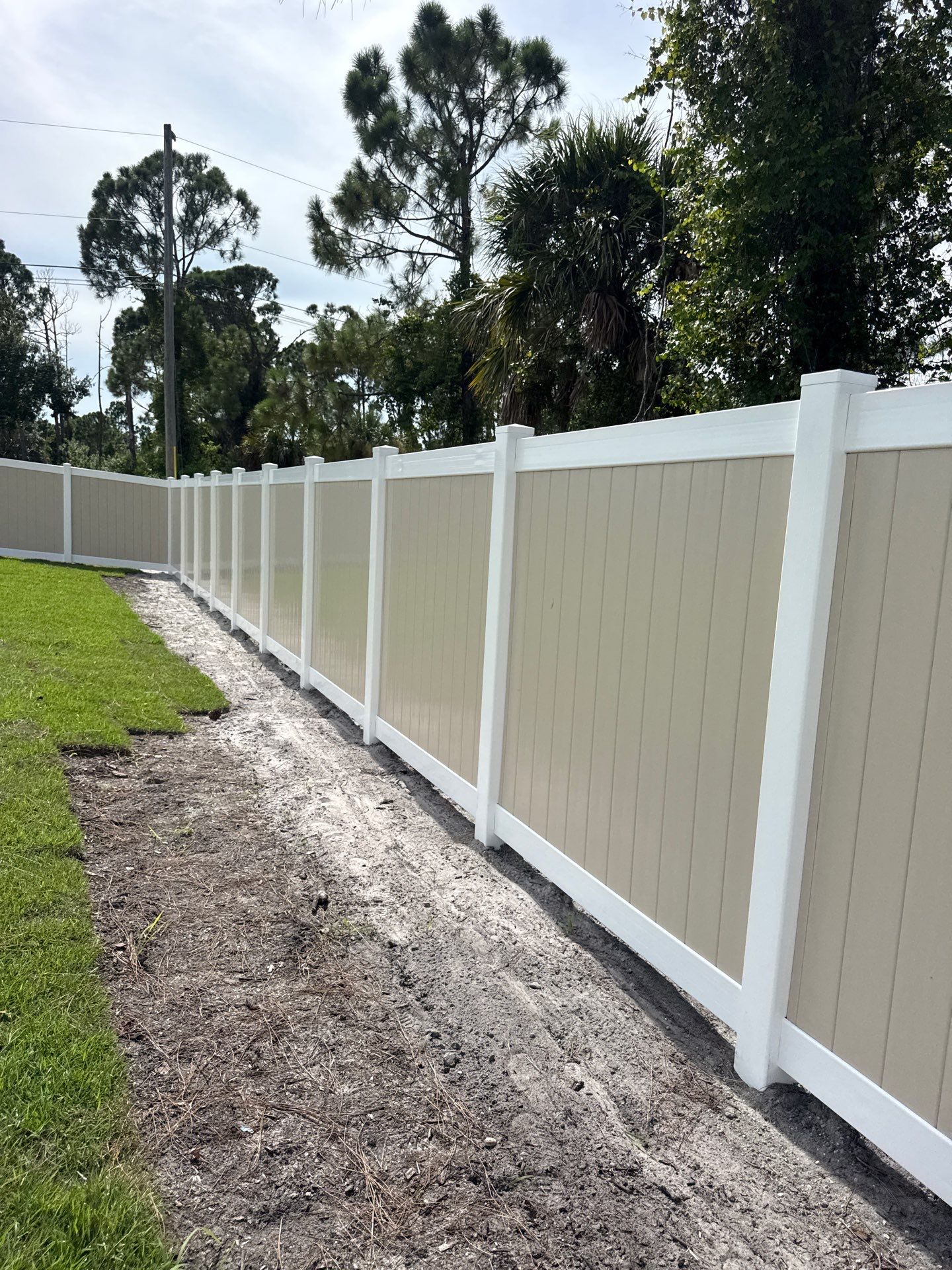 Custom Two-Tone Vinyl Privacy Fence Installation in North Port by True Fence LLC
