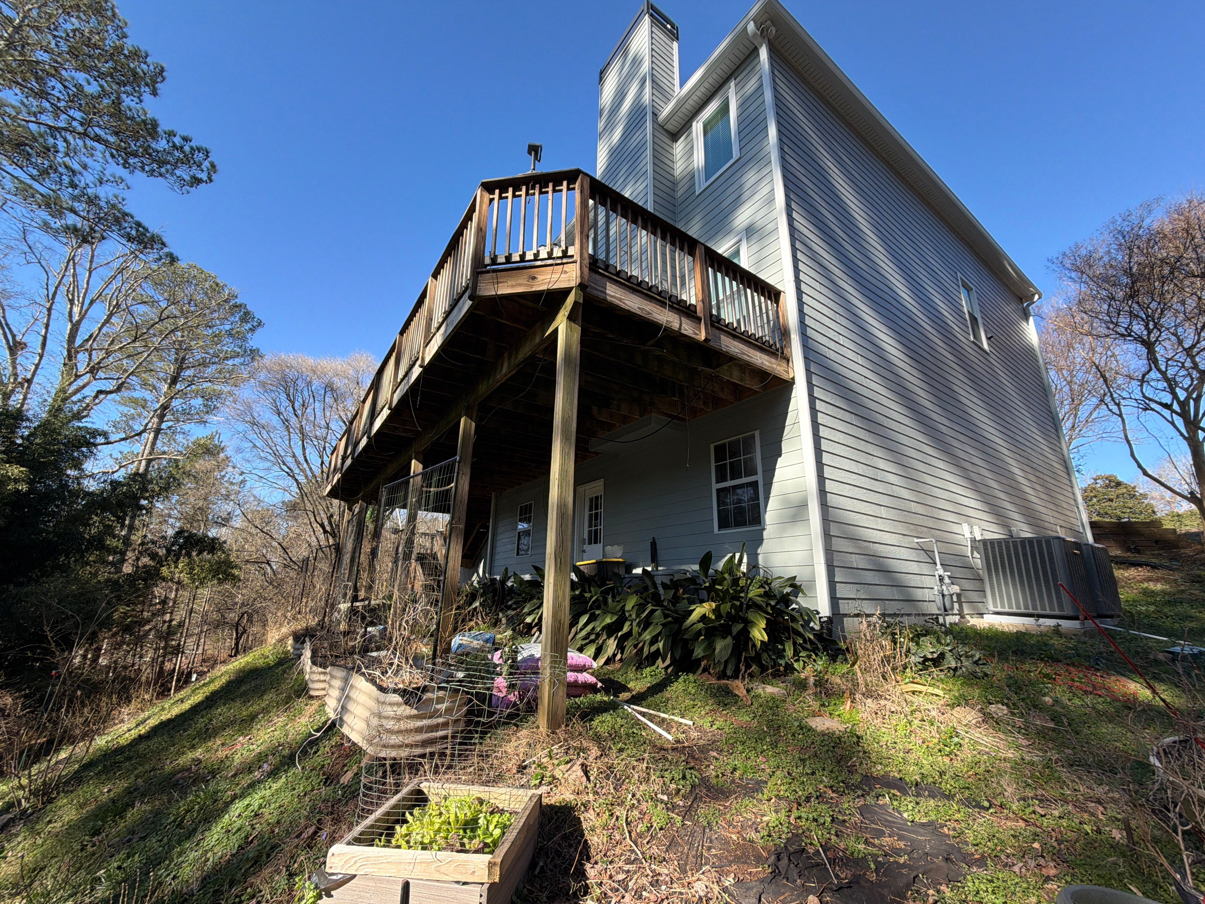 Covered Porch and Deck Build using Deckorators Venture Series Decking and Trex Select Aluminum Railing by Nelson Exteriors