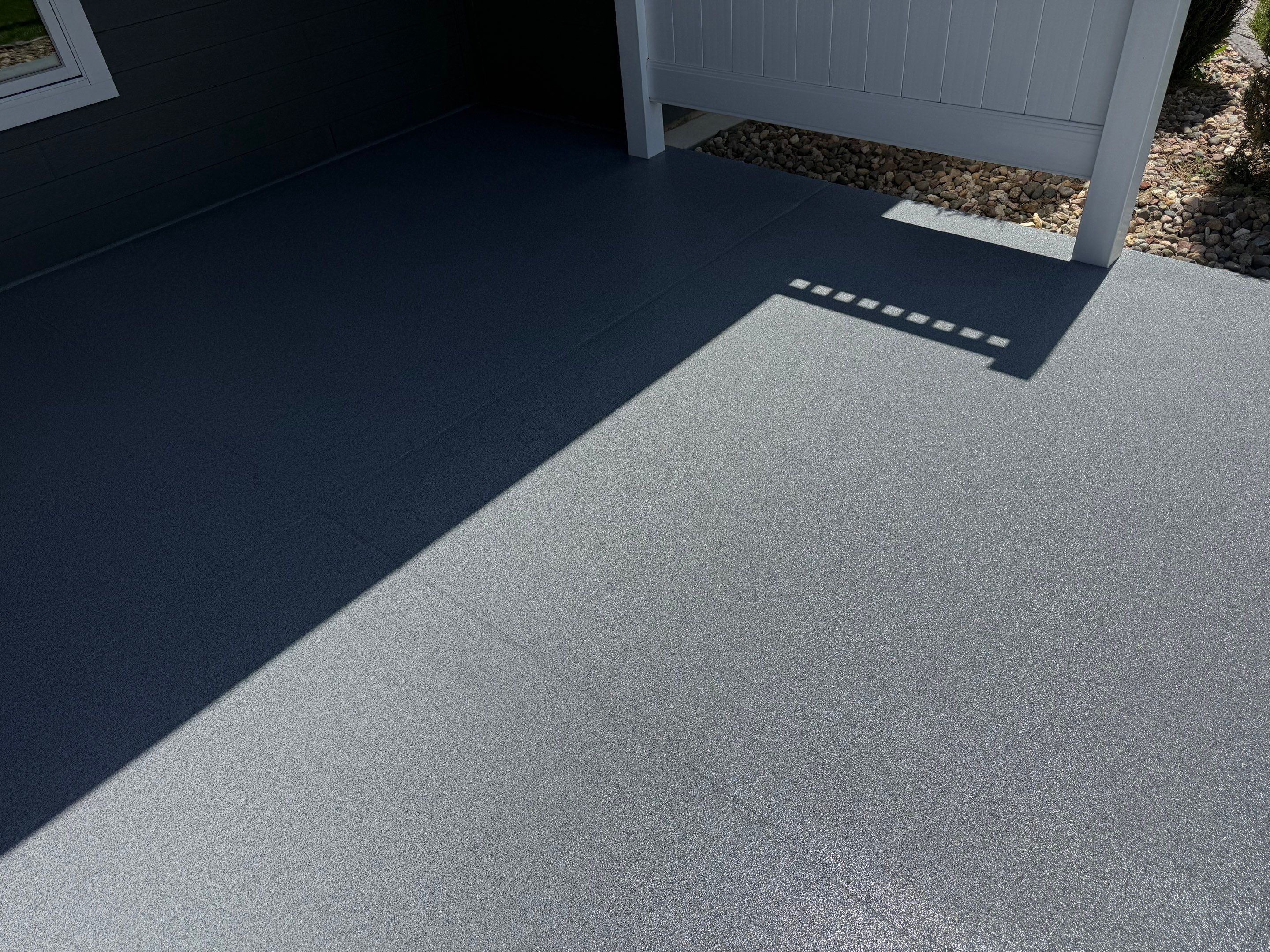 Polyurea Patio Floor Coating in Starry Evening for Sioux Falls Home by Select Painting, Coatings & Garage Cabinets