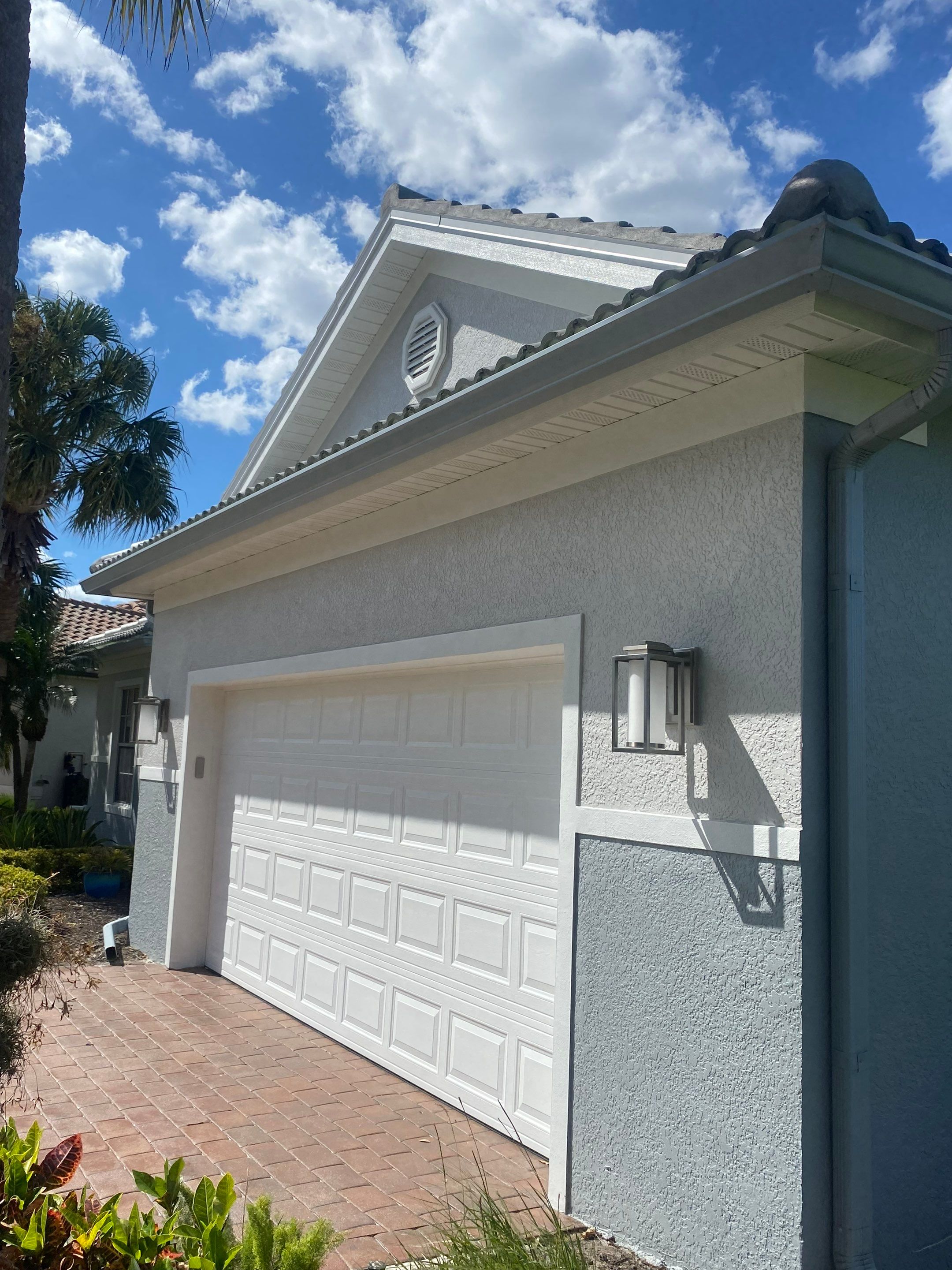 6-inch K-style Seamless Gutters and Splash Guard in Grey Color in Naples FL by Gutter Professors