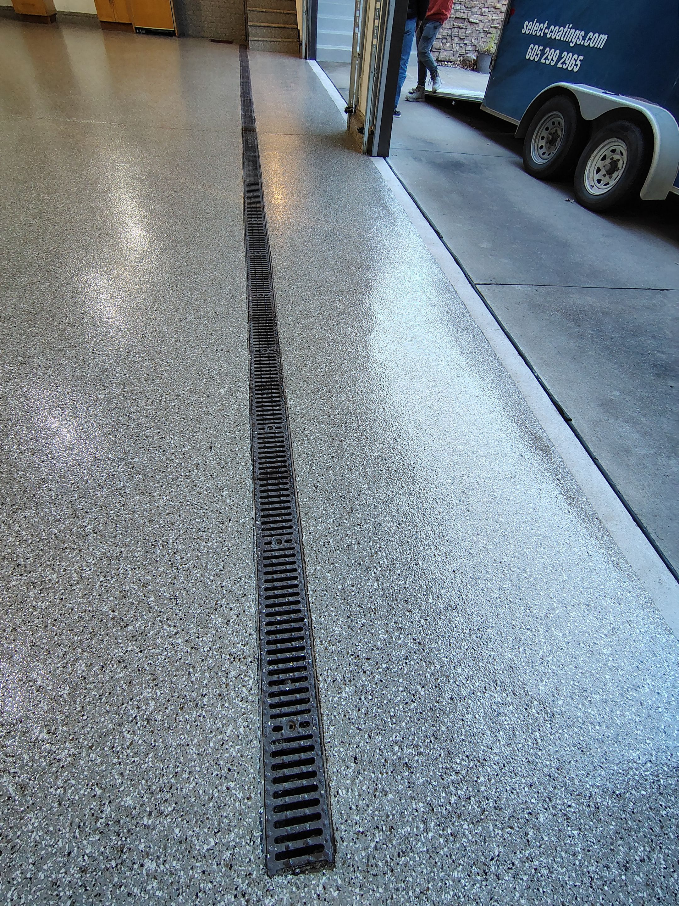 Garage Floor and Entry Step Concrete Coating in Sioux Falls by Select Painting, Coatings & Garage Cabinets