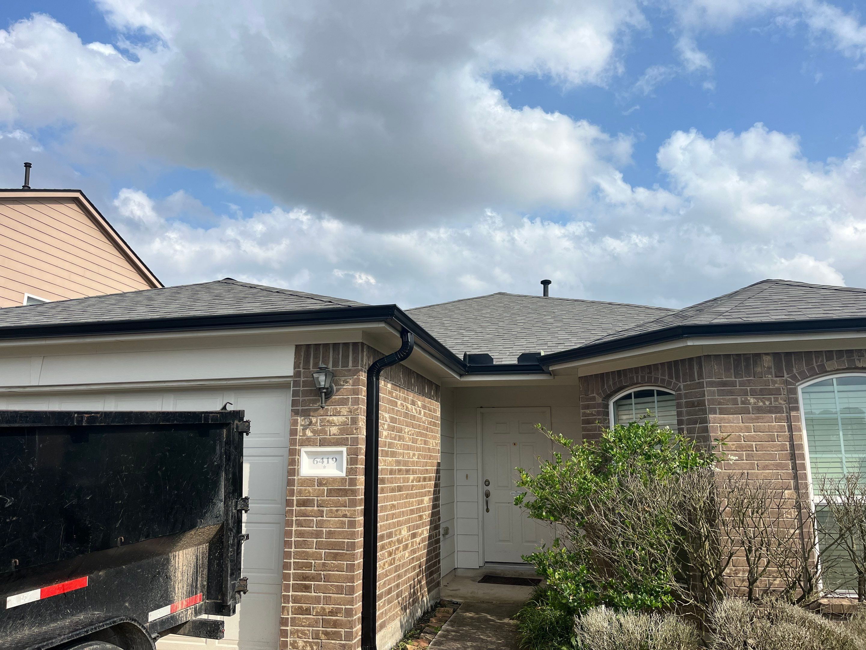 Reroof and Gutter Project in Houston by Roofing Technologies Unlimited