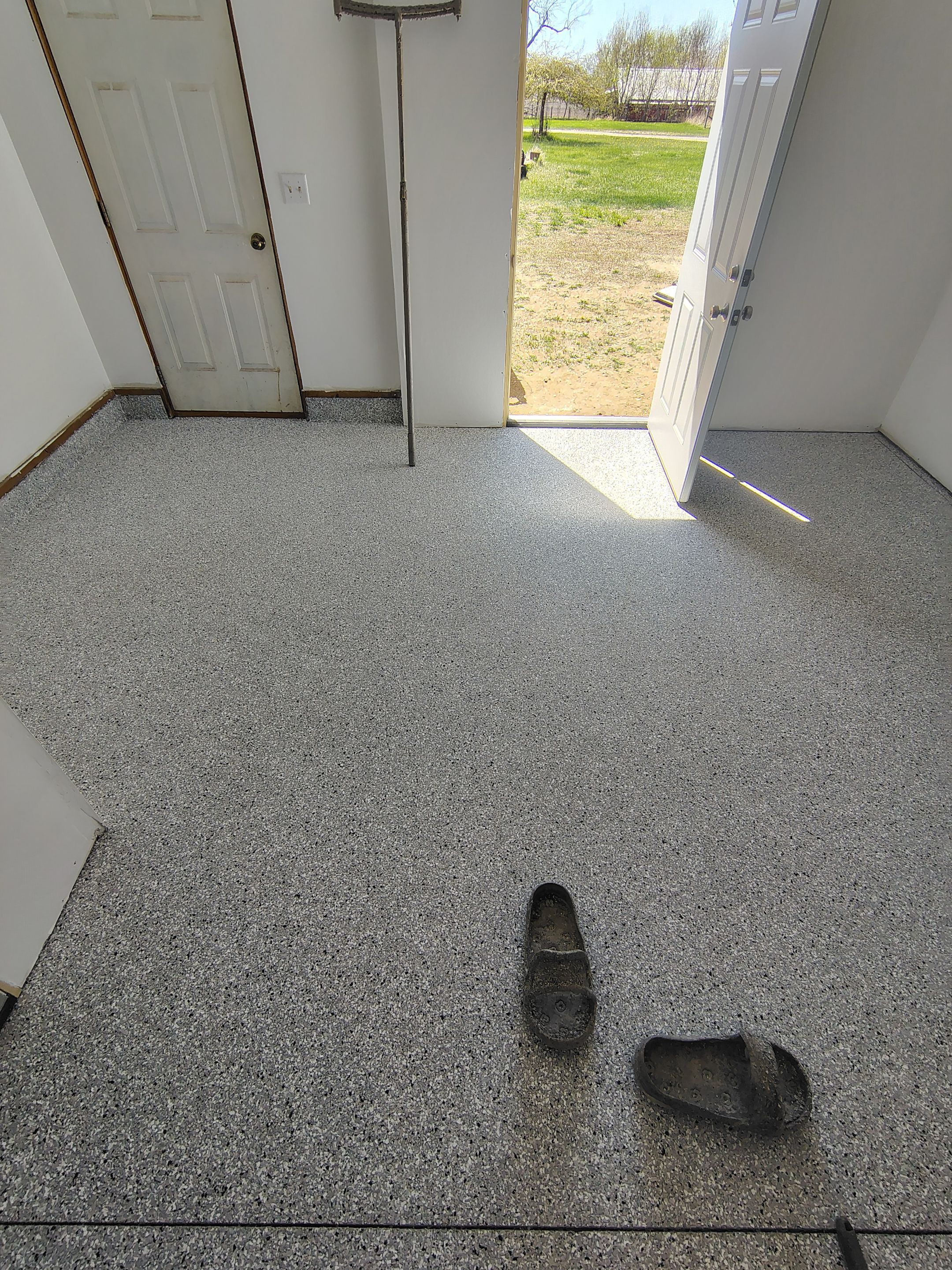 Decorative Chip Concrete Coating Installation in Luverne by Select Painting, Coatings & Garage Cabinets