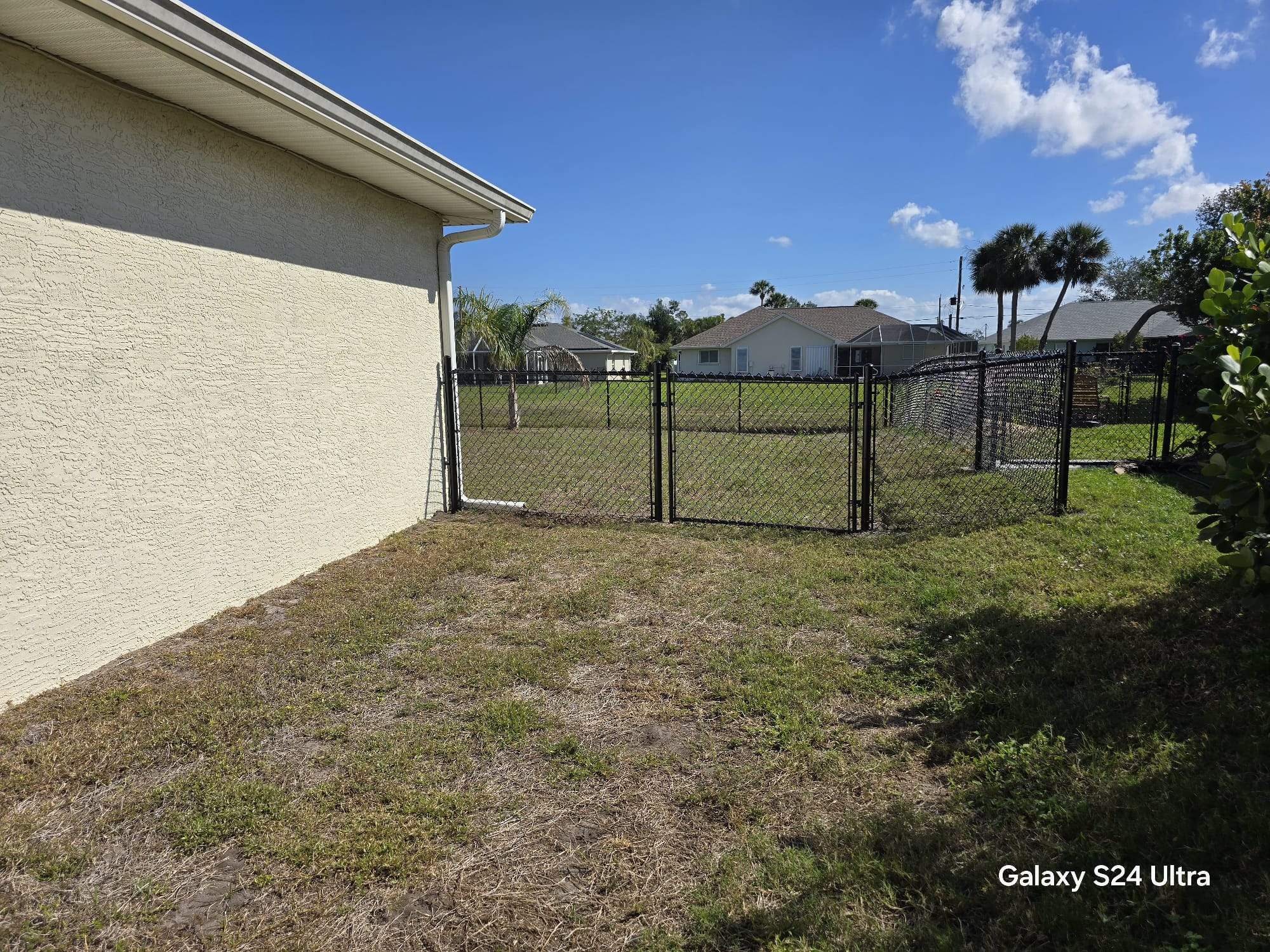 Waterfront Black Chain Link Fence Installation in Rotonda West by True Fence LLC