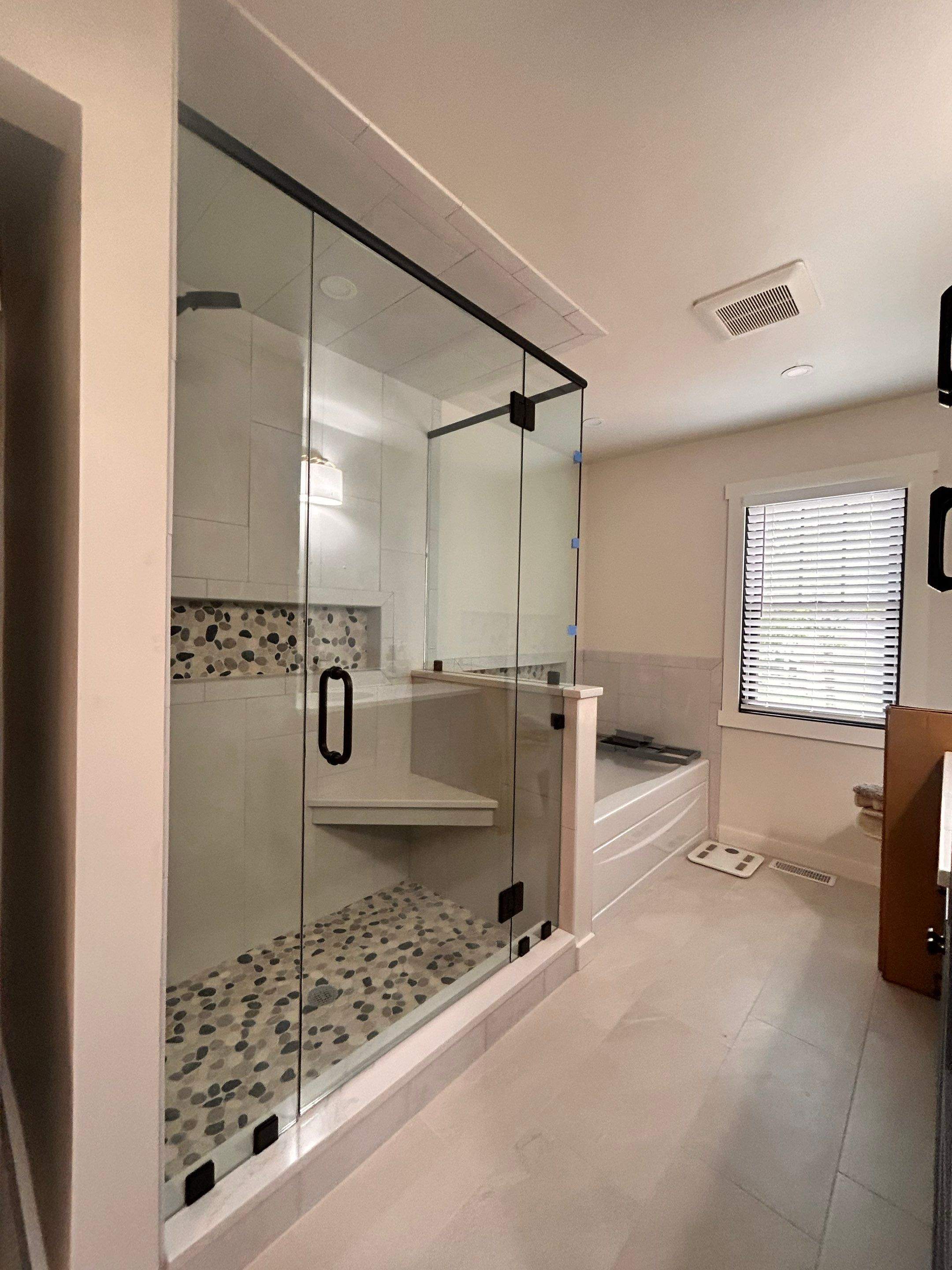 Frameless Shower Enclosure w/Header Bar by Cheshire Glass Company