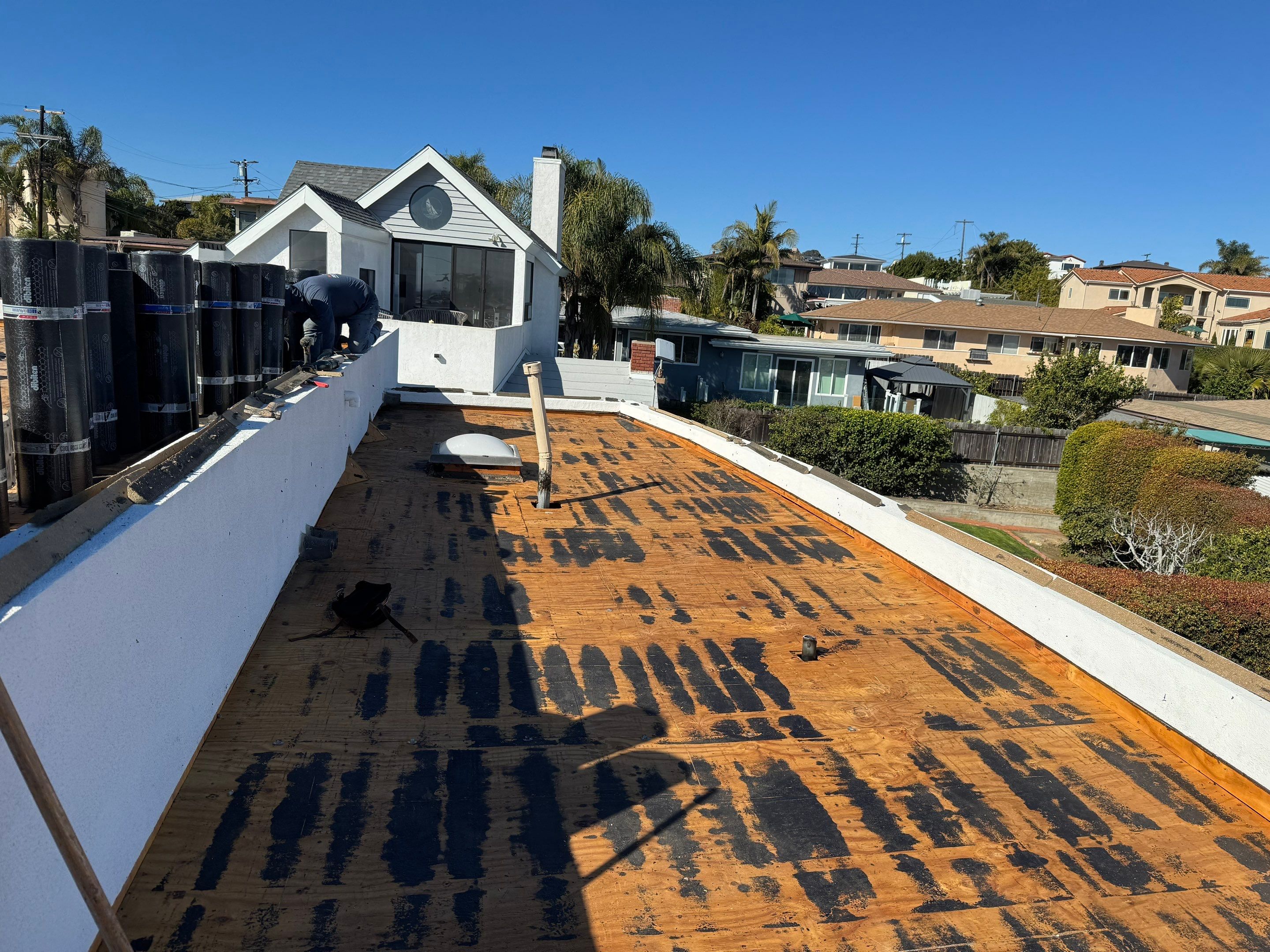 Point Loma Flat Roof Replacement – Johns Manville Bright White Torch-Applied Roofing System by Zenith Roofing Services 