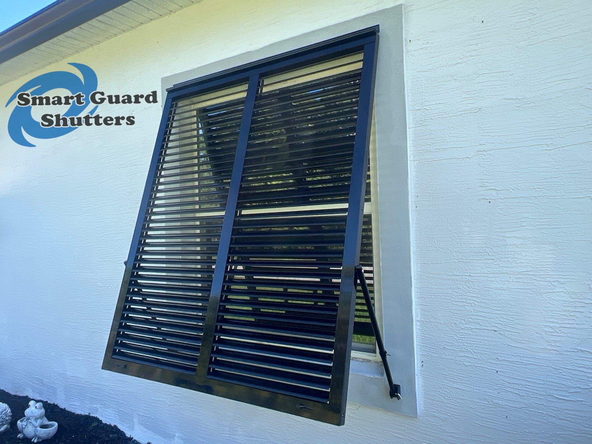Impact Bahama Shutters in Jet Black by Smart Guard Shutters