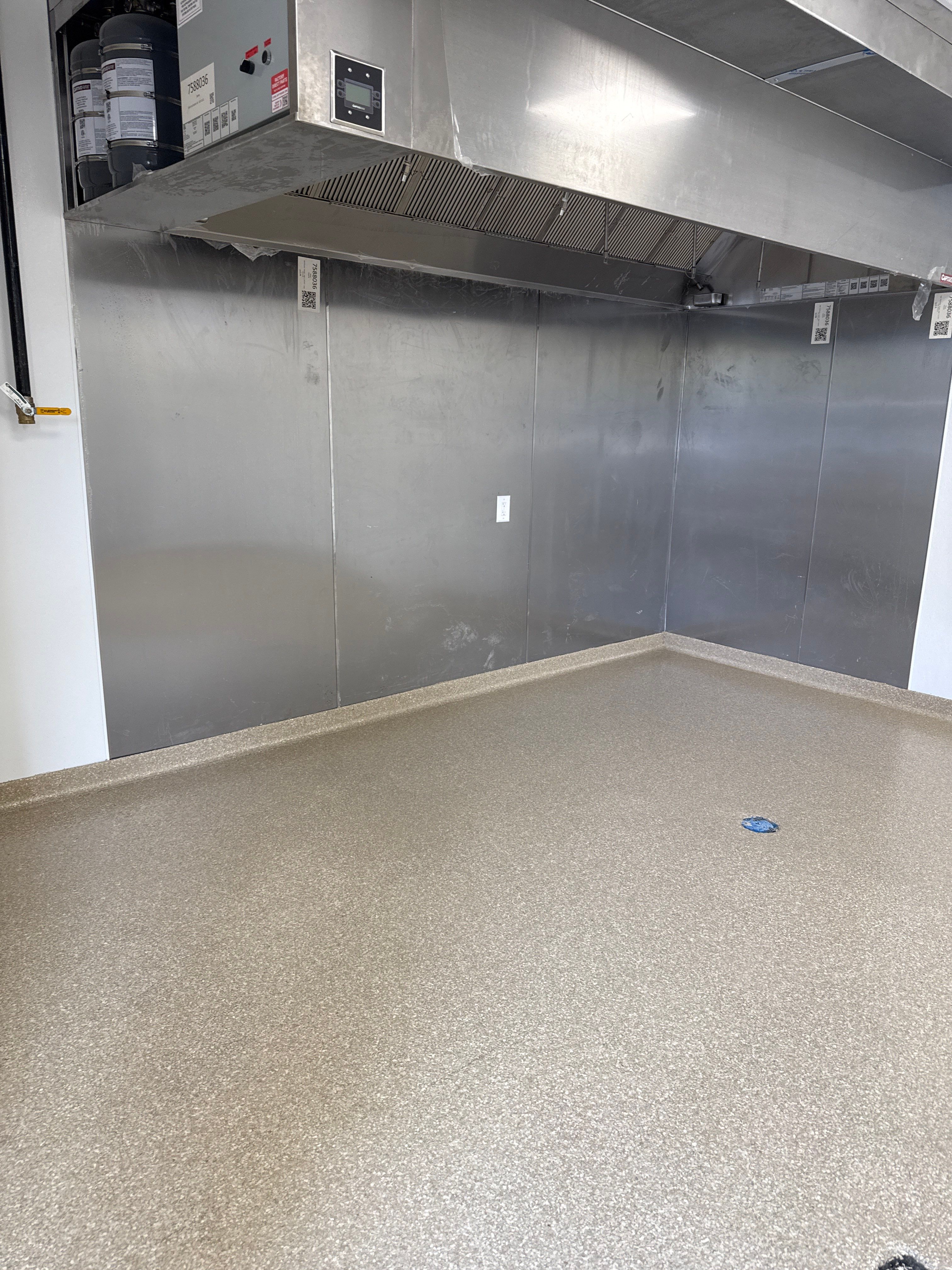 Industrial Epoxy Flake and Concrete Overlay Floor Installation in Pensacola by Cornerstone Hard Surface Restoration