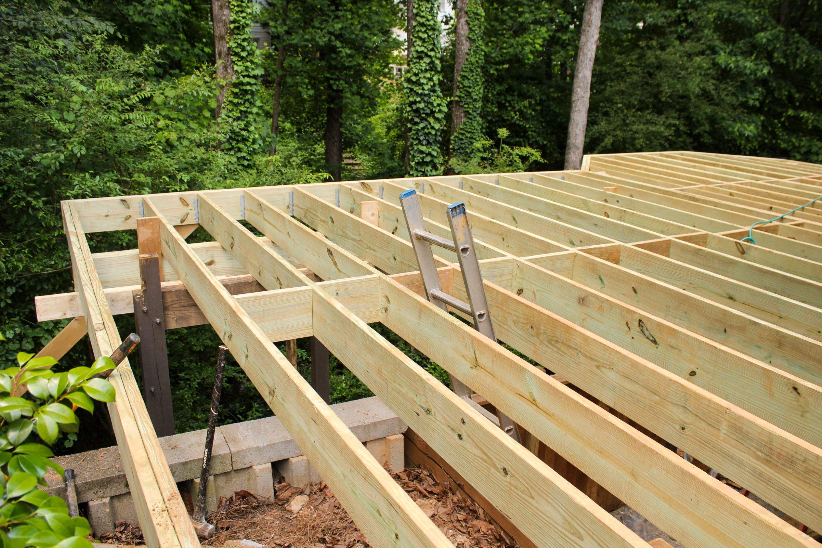 Deckorators Voyage Deck and Shed Style Covered Porch Build with Drink Rail by Nelson Exteriors 
