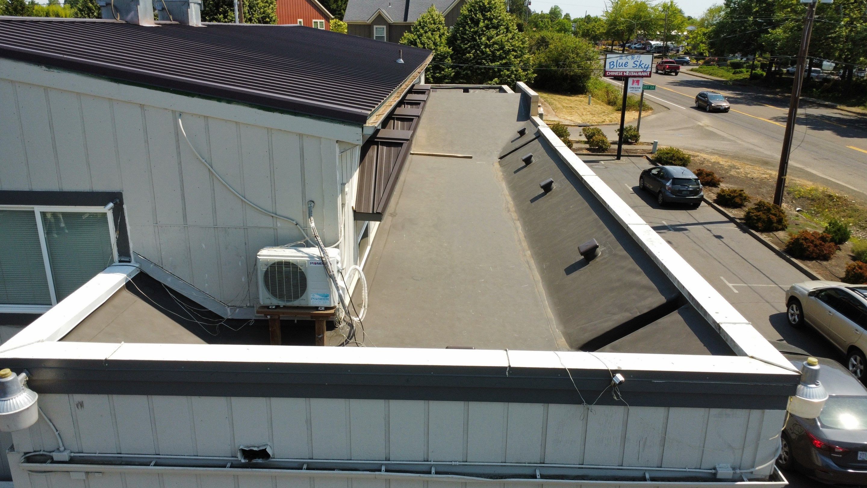 Commercial Flat Roof Installation using Bruce and Dana Snap Lock Metal (Color: Brown) by Orezona Building & Roofing Company, Inc.
