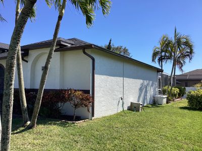 Brown Gutter + White and Brown Downspouts in Cape Coral FL
