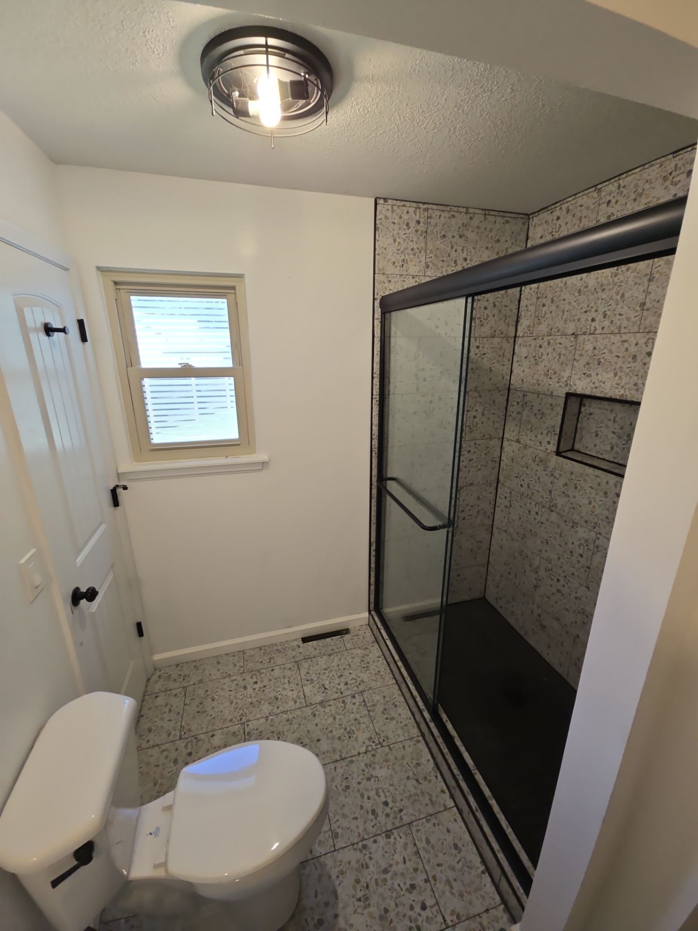 Fragmento tile bathroom floor and shower walls by The Shower Company