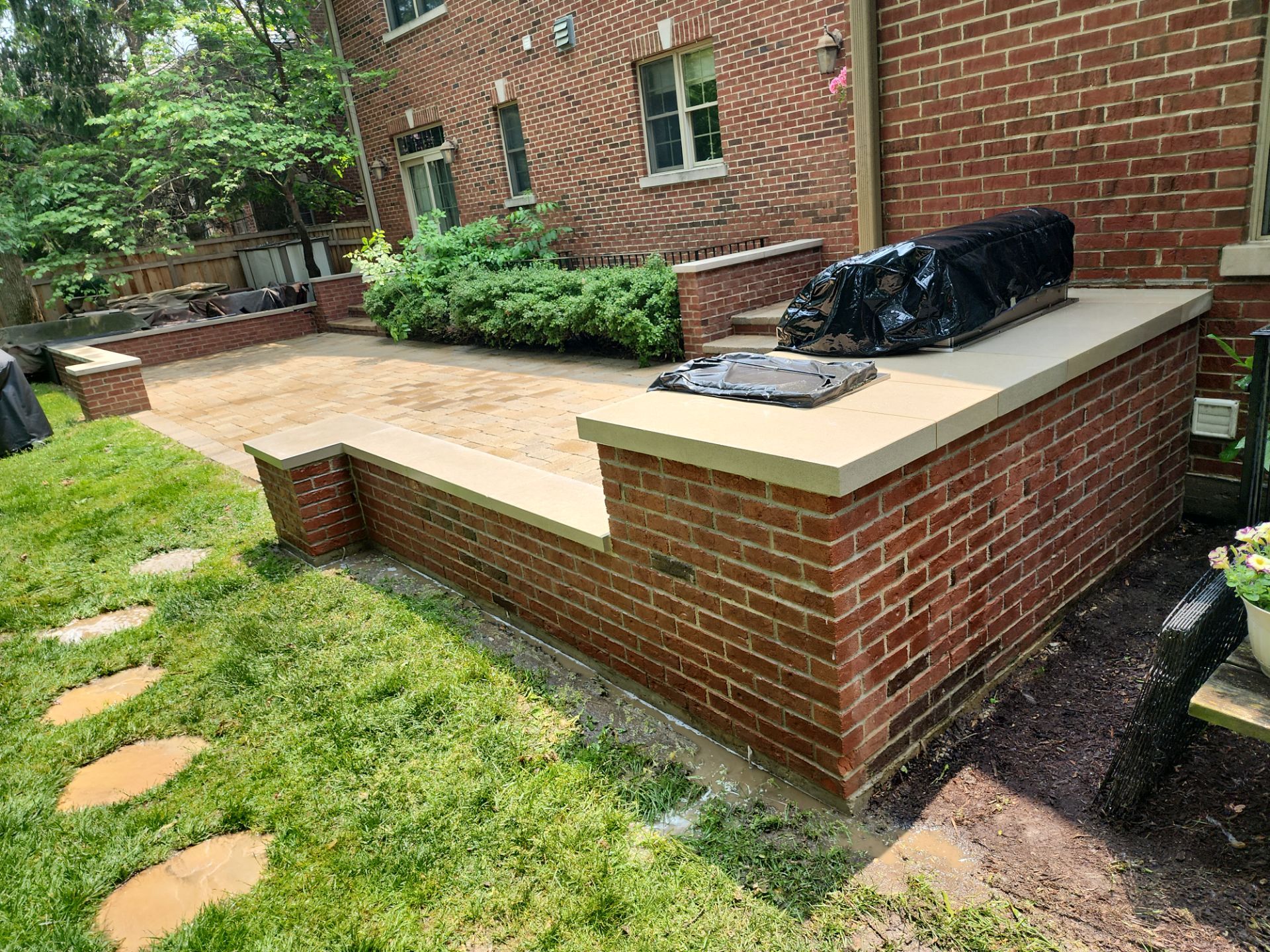 Brick paver repair, clean, seal and poly sanding by Northern Power Washing LLC.