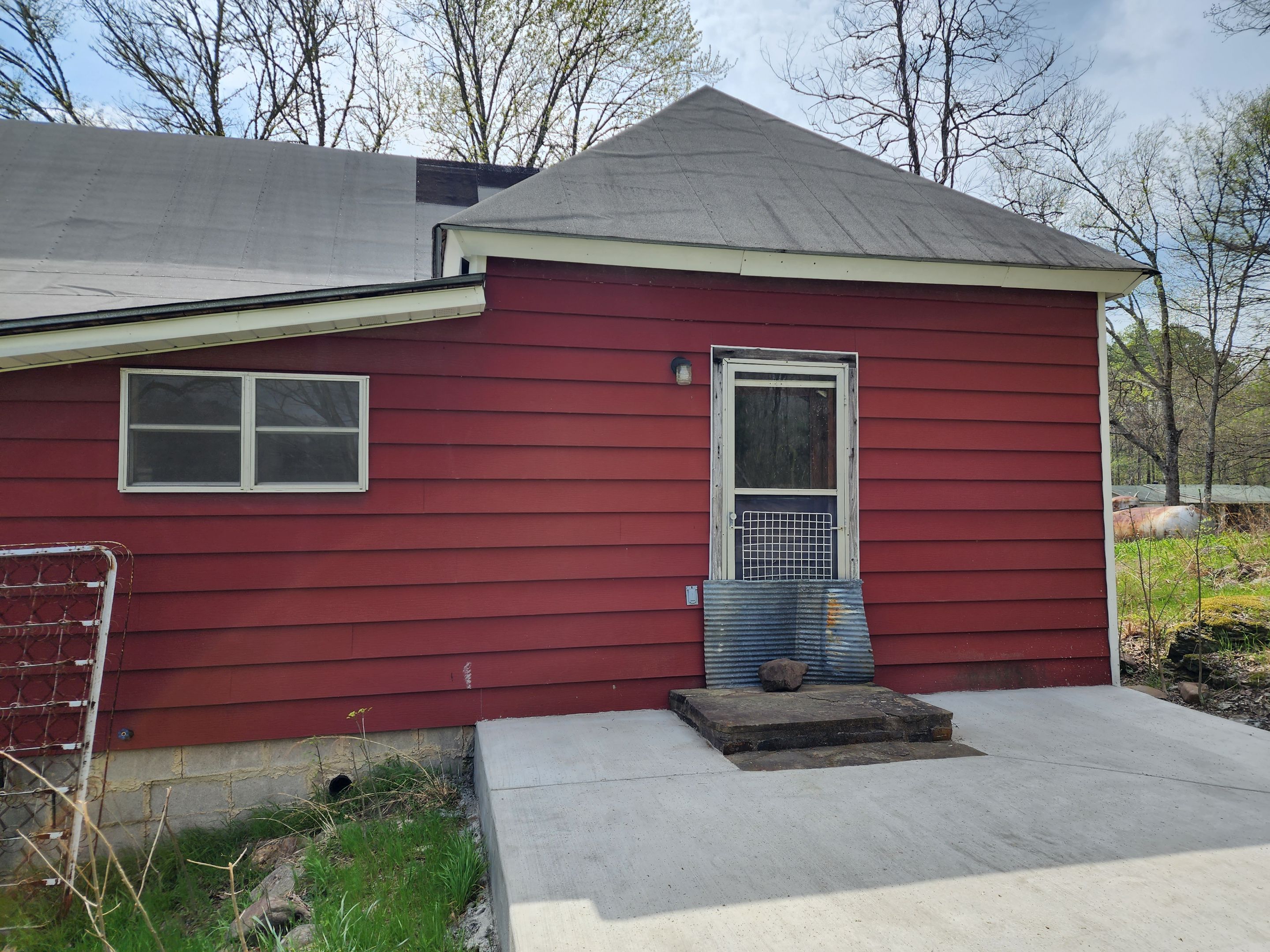 Residential Roofing Installation using 26 Gauge Colored Panels by Hostetler Roofing