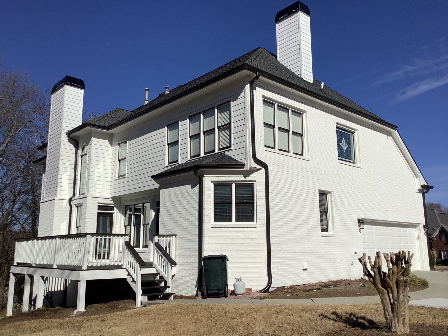 White Brick Exterior Painting and Deck Refinishing in Duluth by Swift Home Renovations