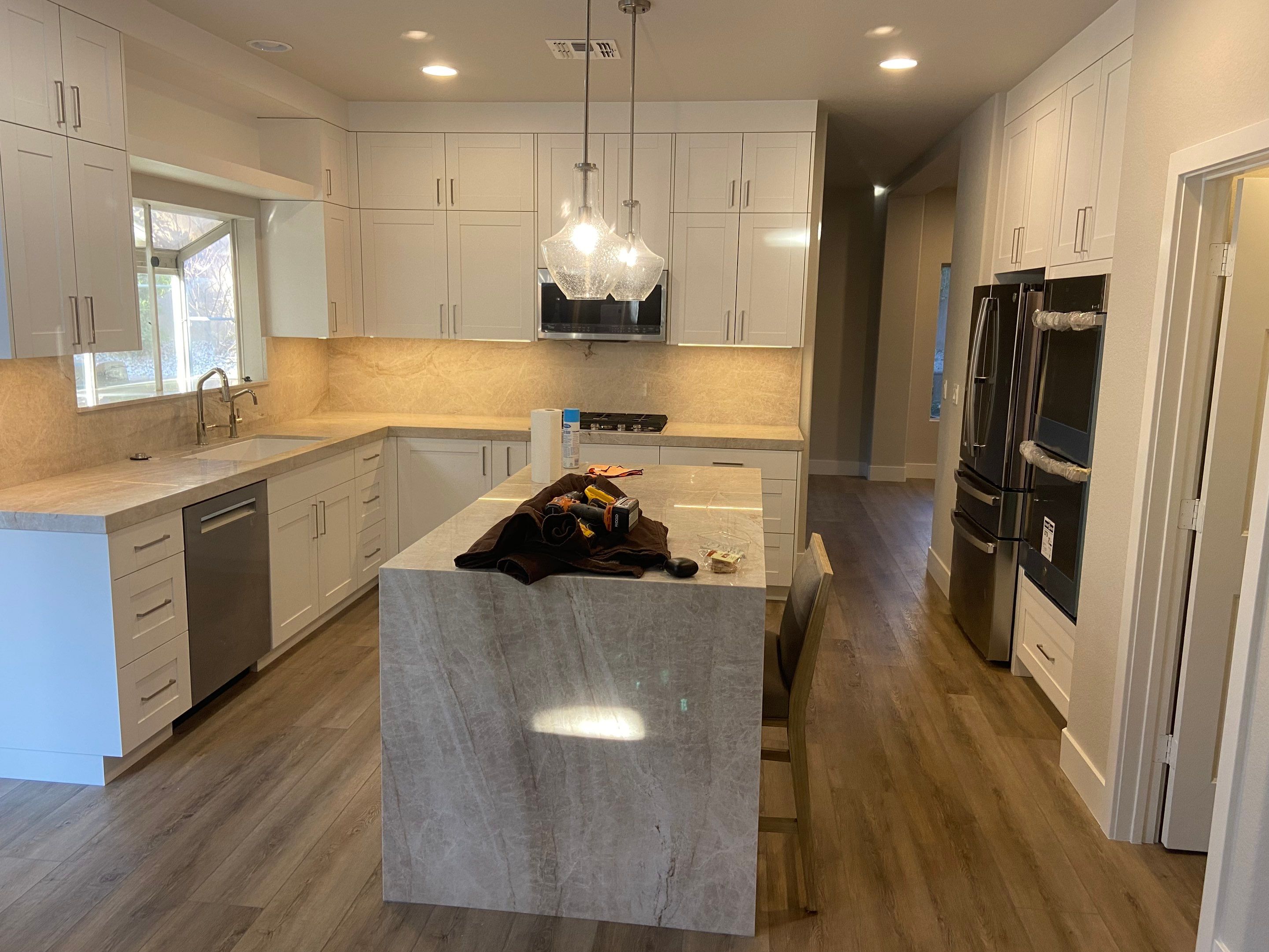 Stair refinish & cosmetic remodel  by Level Builders