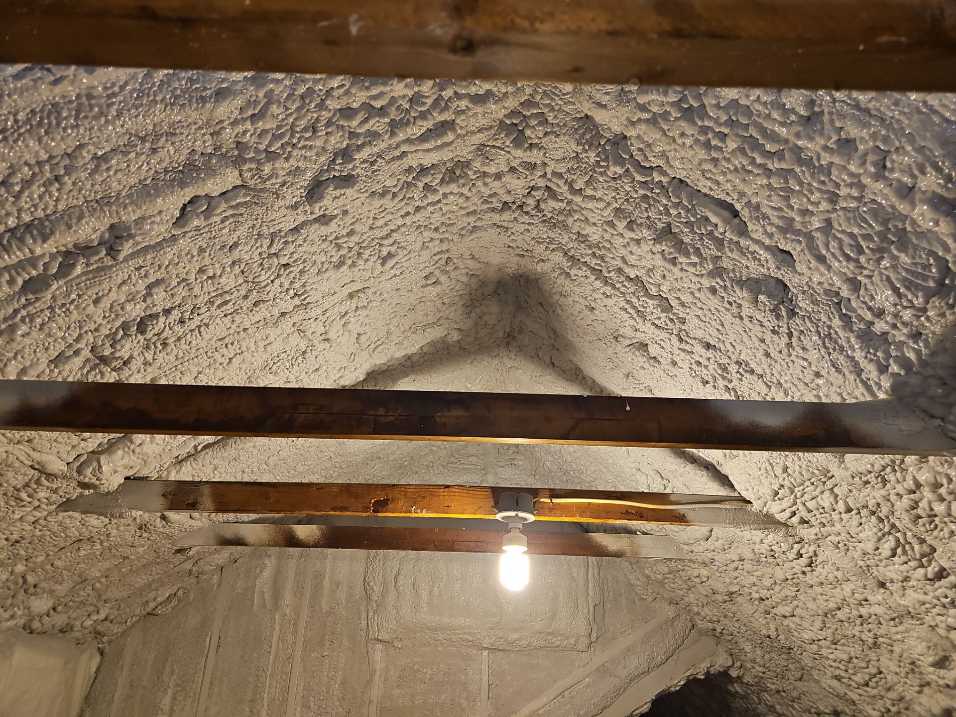 Attic Retrofit using open cell spray foam by NYS Foam & Energy