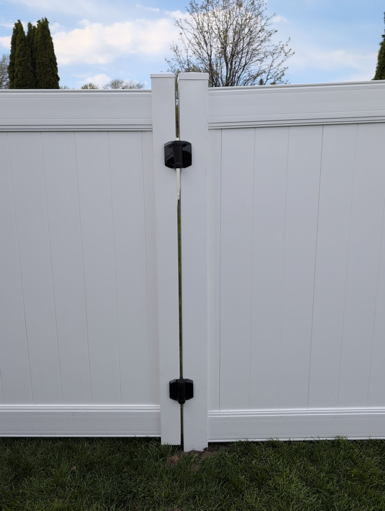 White Vinyl Privacy Fence Installation in Raymond, Iowa by Perfect Picket Fence and Stain