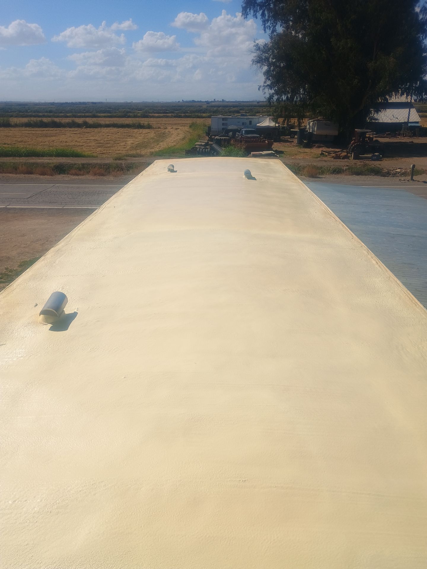 Foam and coatings on mobile home by Straight Edge Roofing Inc