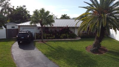 Residential Roofing Installation using 1" Nail strip metal roof