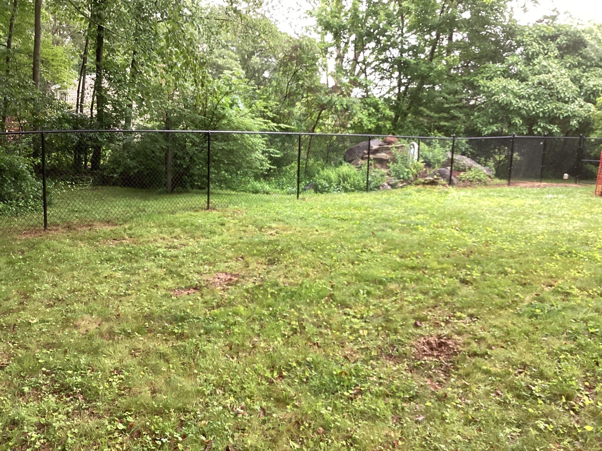 New Black Chain link fence with matching gate.  by DiGiorgi Roofing and Siding Inc
