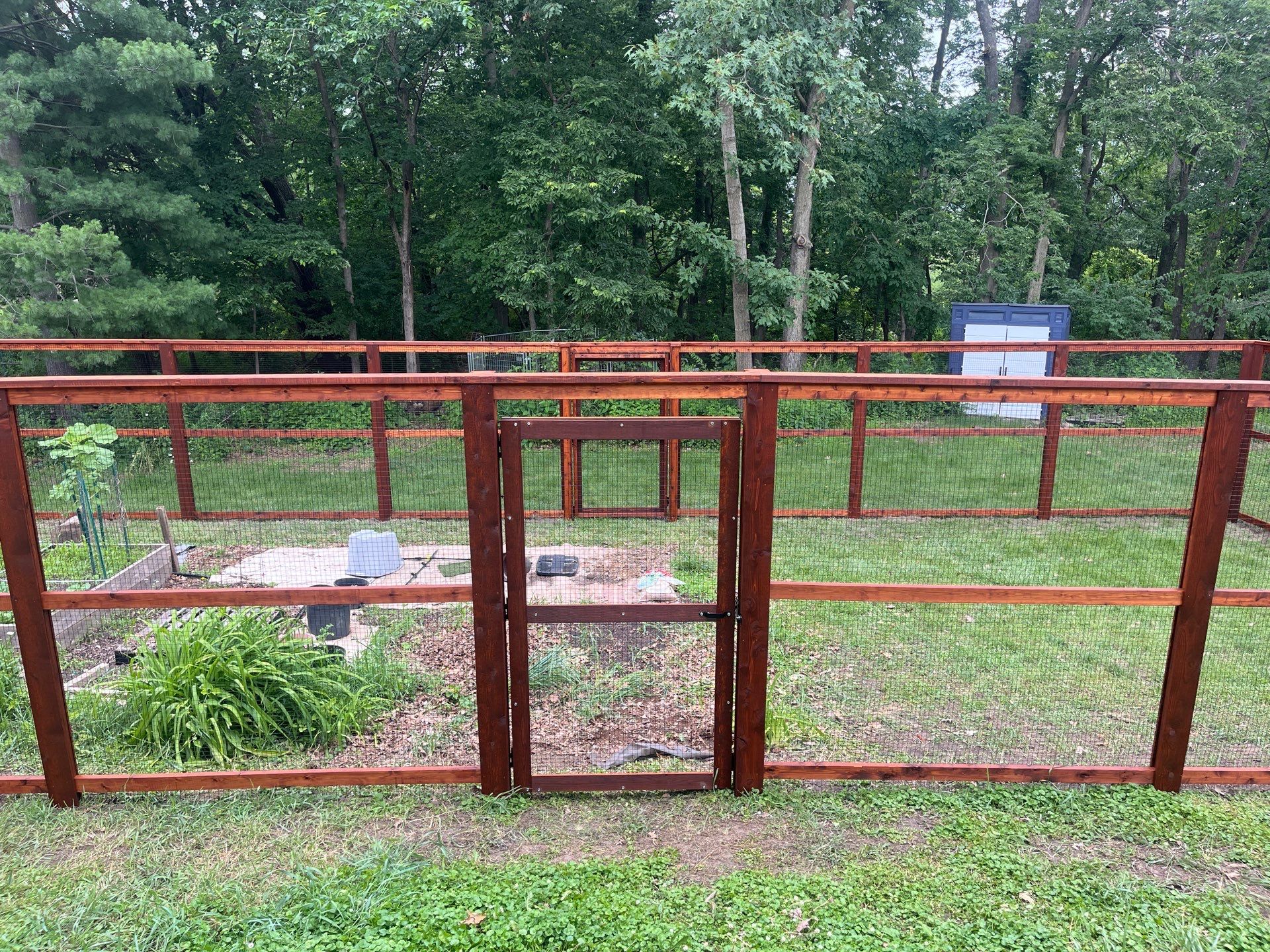 Stained Cedar Mahogany Garden Fence and Raised Bed Enclosure in Cedar Falls by Perfect Picket Fence and Stain