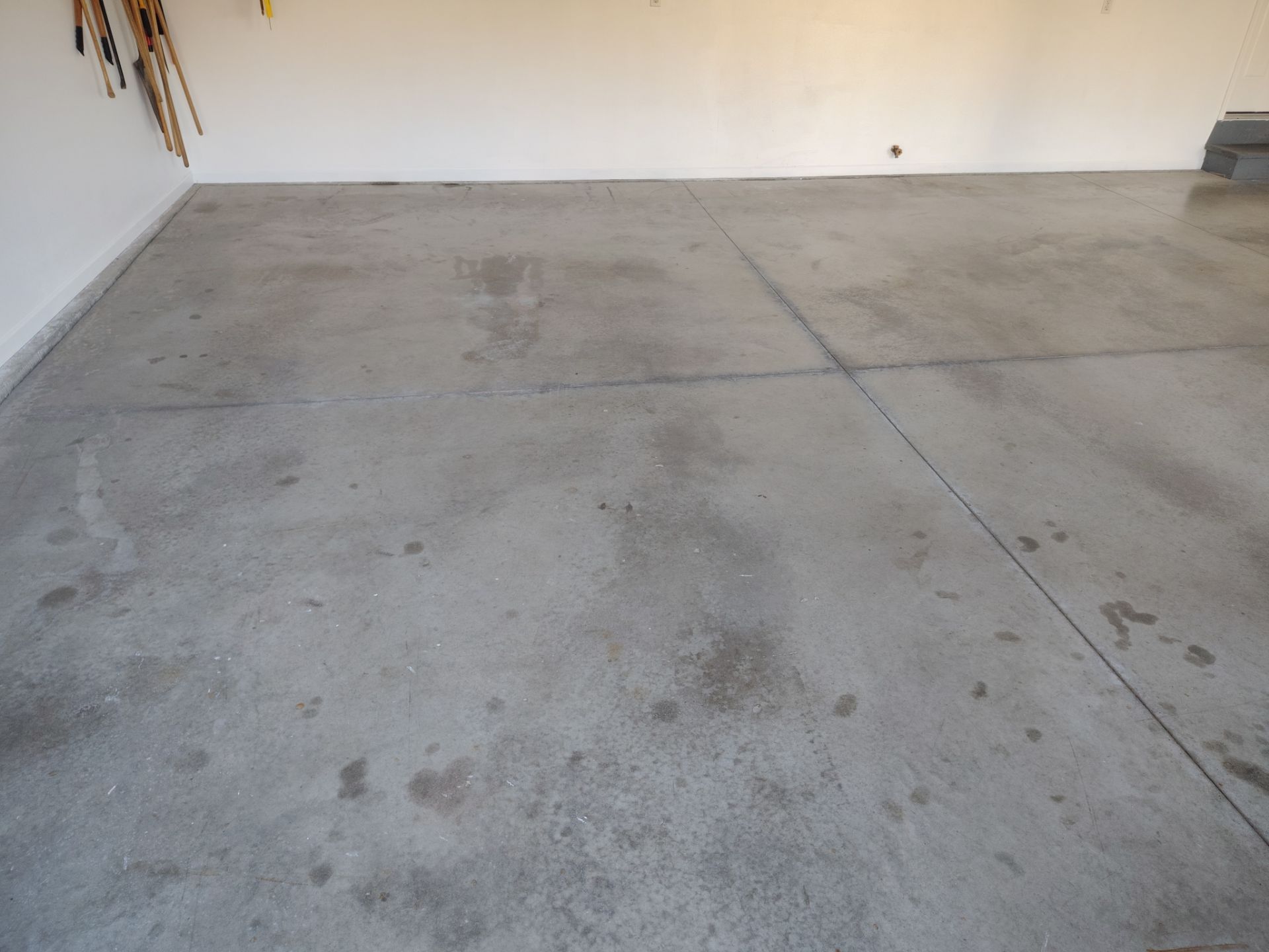 New Johnston Garage Resurfacing by Revival Concrete Coatings, LLC