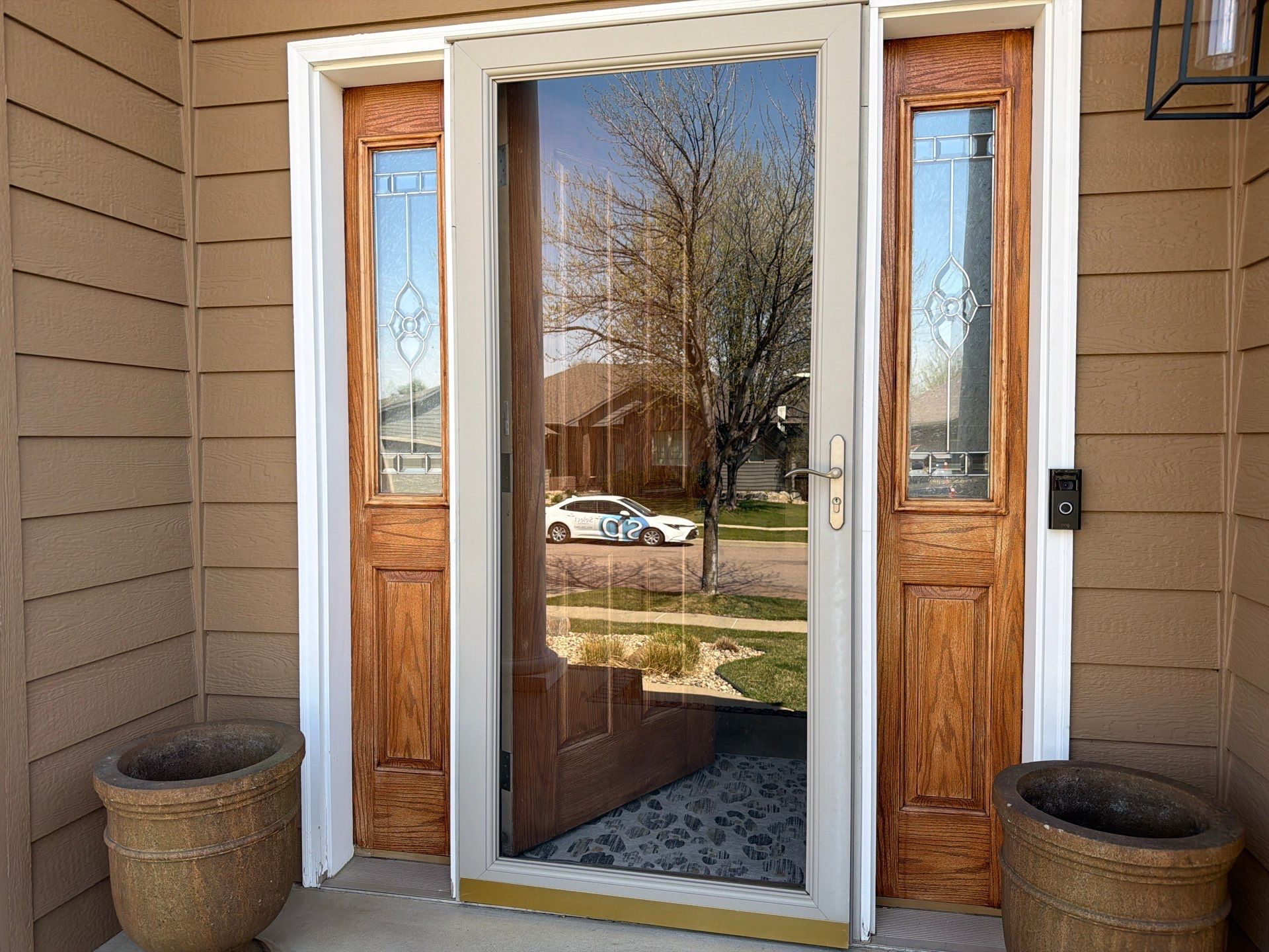 Full Exterior House Painting and Deck Staining in Sioux Falls by Select Painting, Coatings & Garage Cabinets