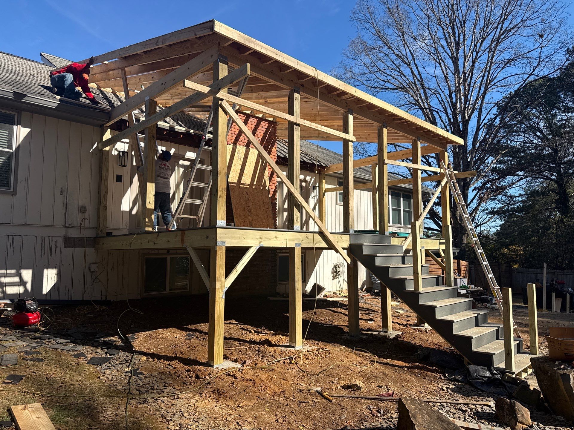 Deck and Shed Roof Style Covered Build using Trex Decking Products by Nelson Exteriors 