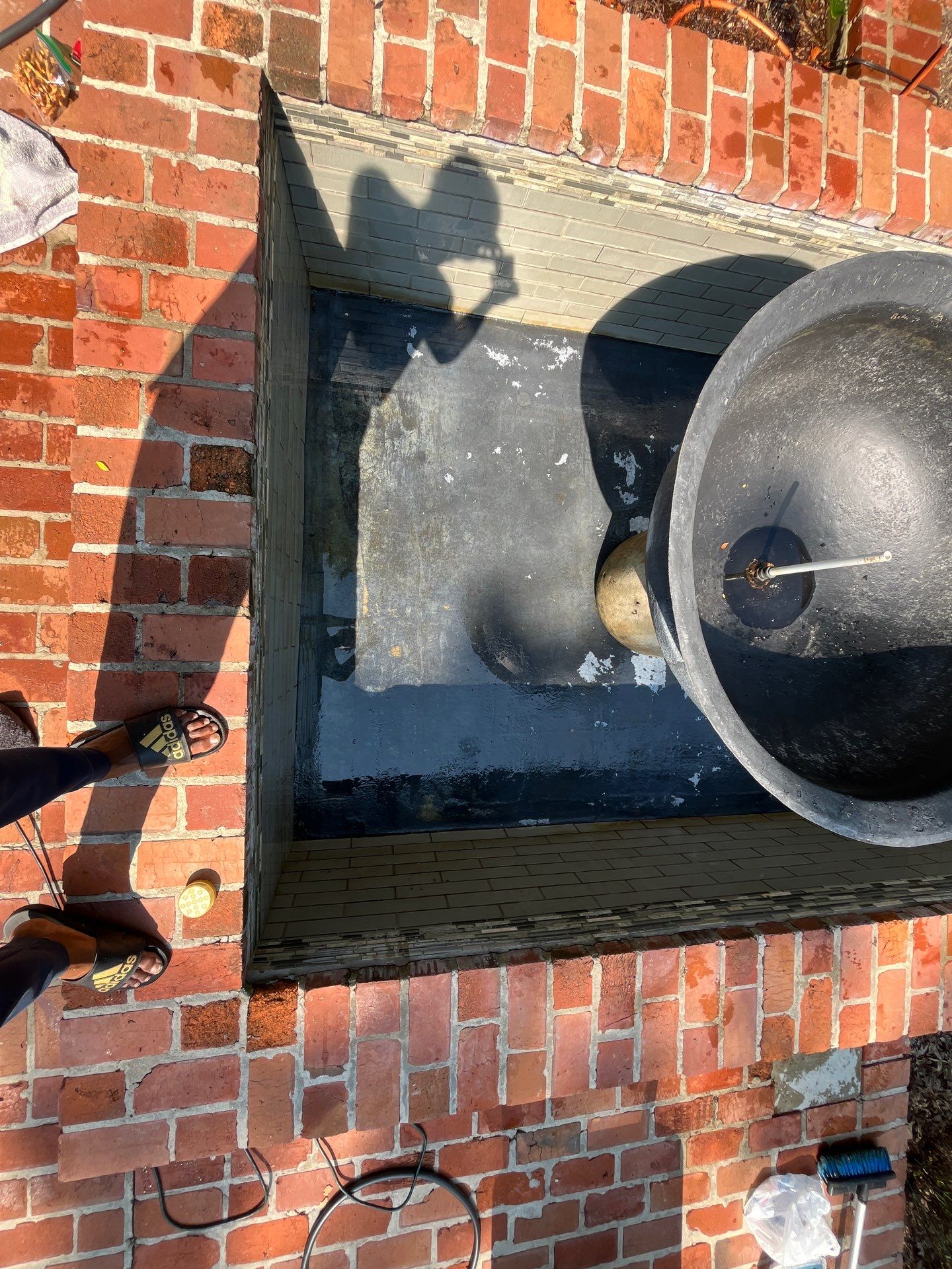 Pool Cleaning using Pool Cleaner by College Bros Outdoor services