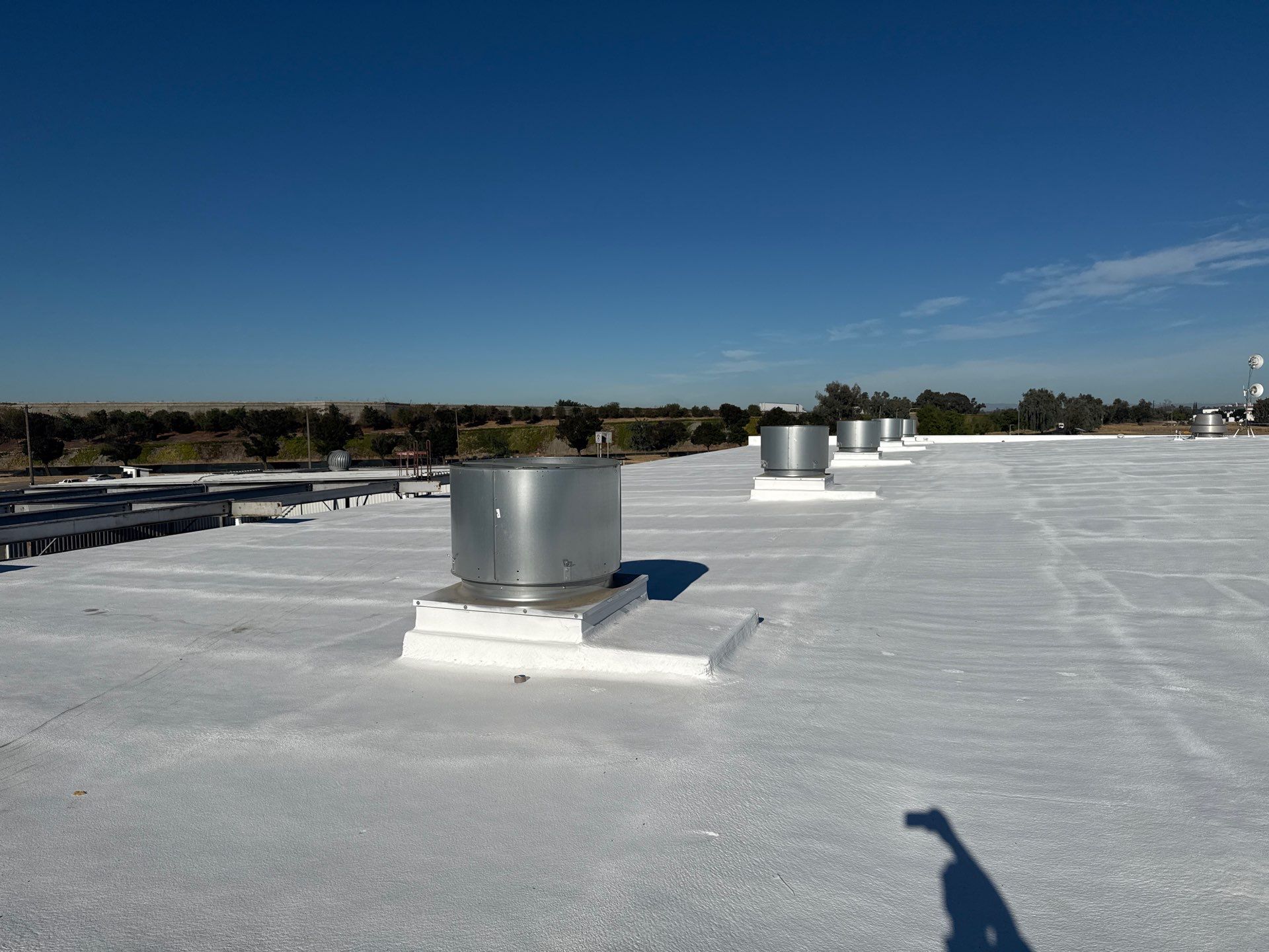 Pro Farms Spray foam roofing project by Straight Edge Roofing Inc