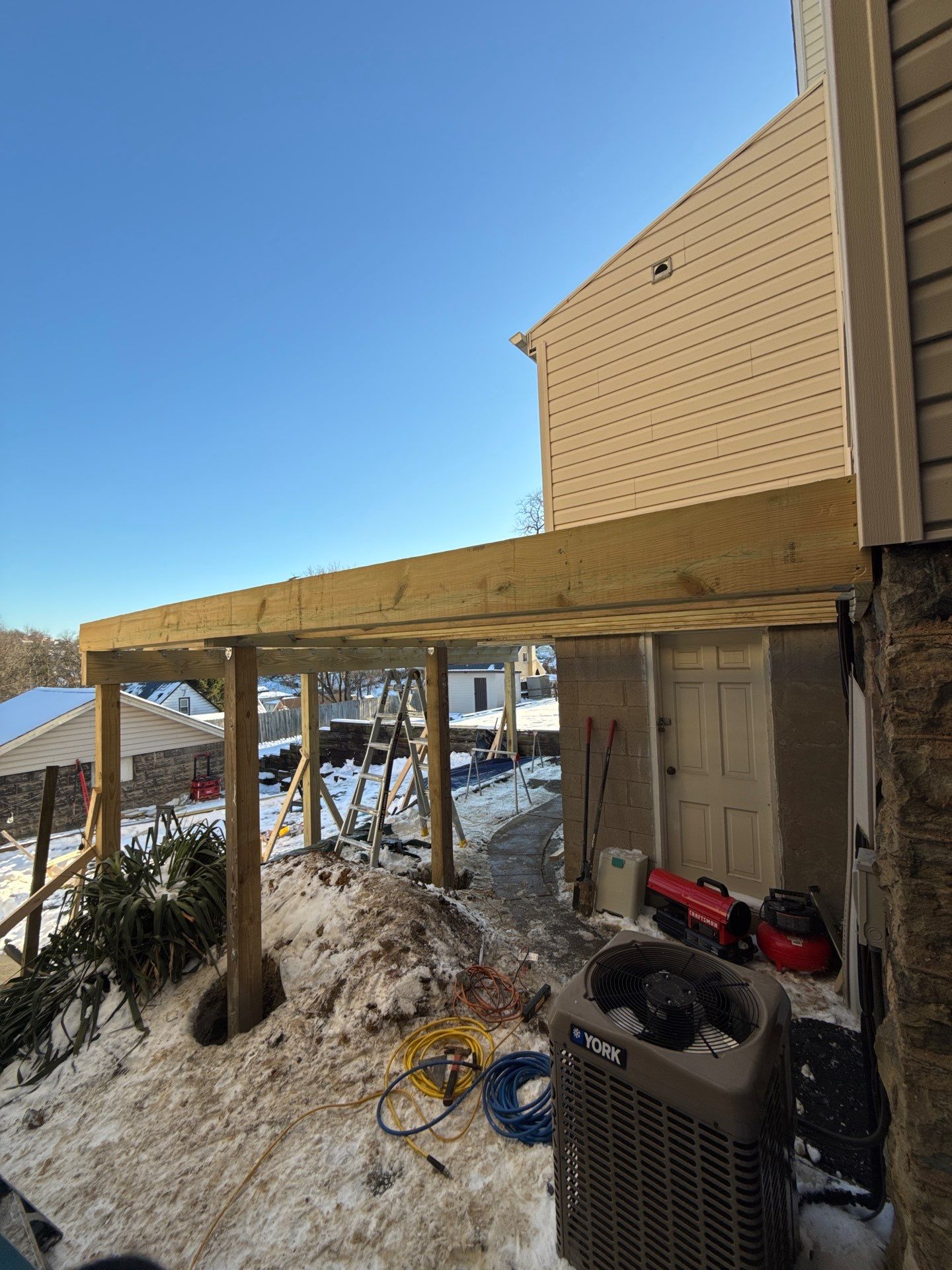 Deck and door by Cousins Roofing Siding & Decks