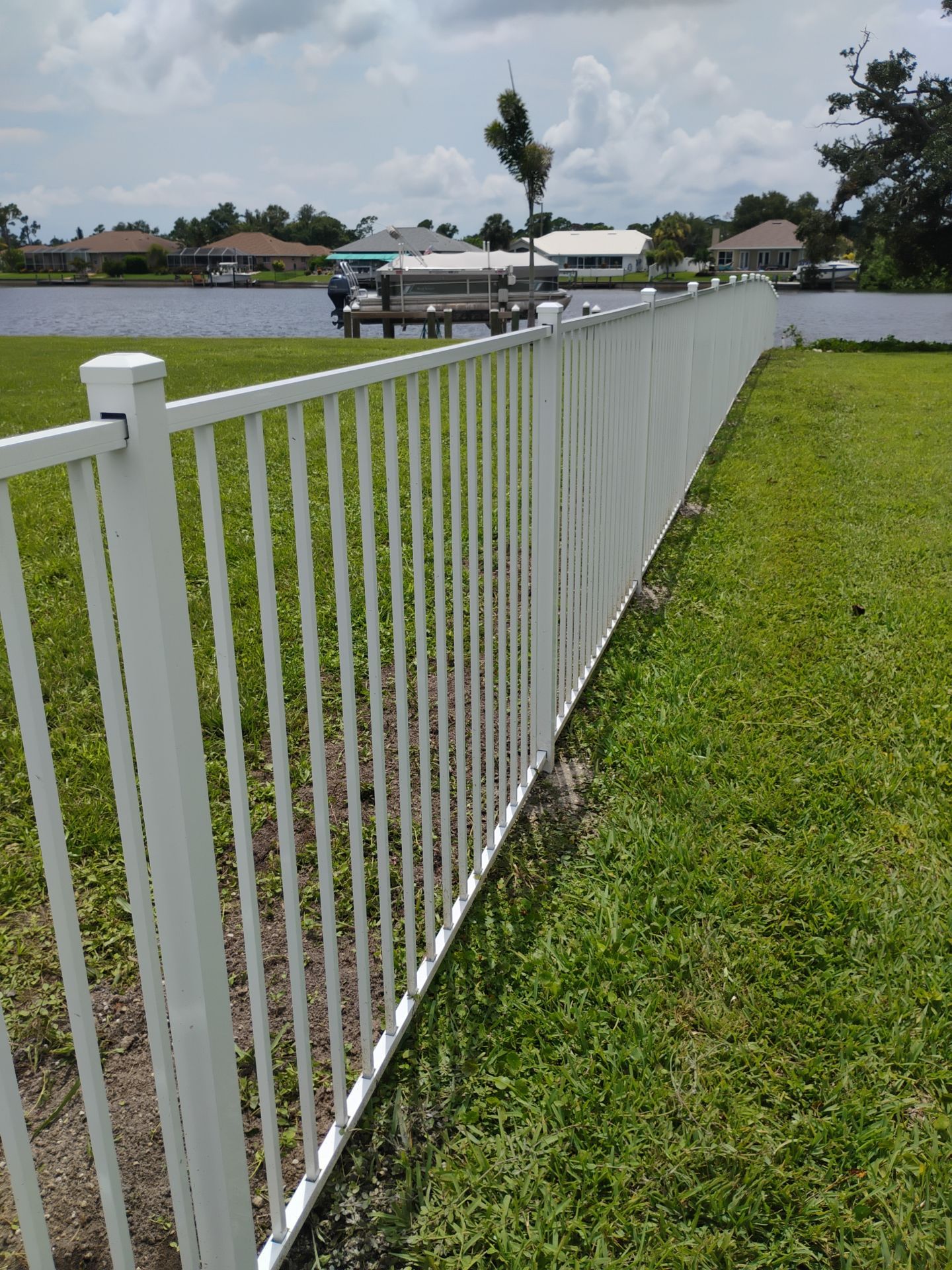 White Aluminum Picket Fence Installation for Port Charlotte Waterfront Home by True Fence LLC