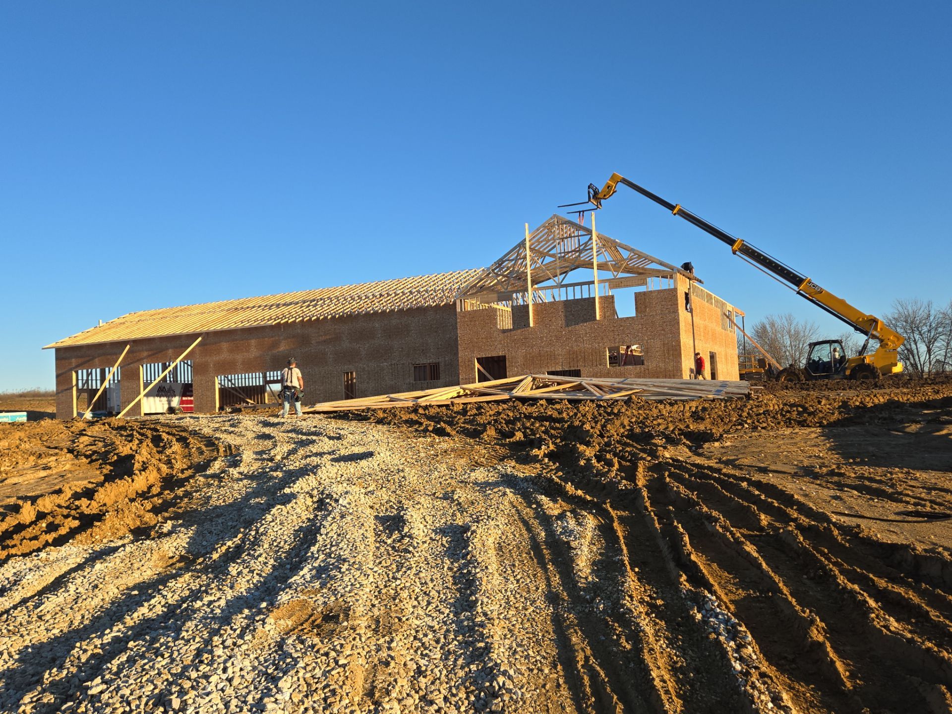 New Home construction w/ board and batten sides and metal roof  by Miles Construction 