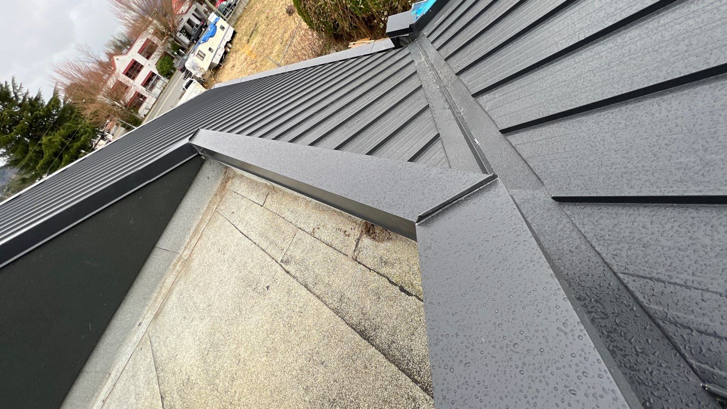 Commercial Roofing Installation using 12" Prolok metal and hidden gutters! by Top Notch Roofing Inc