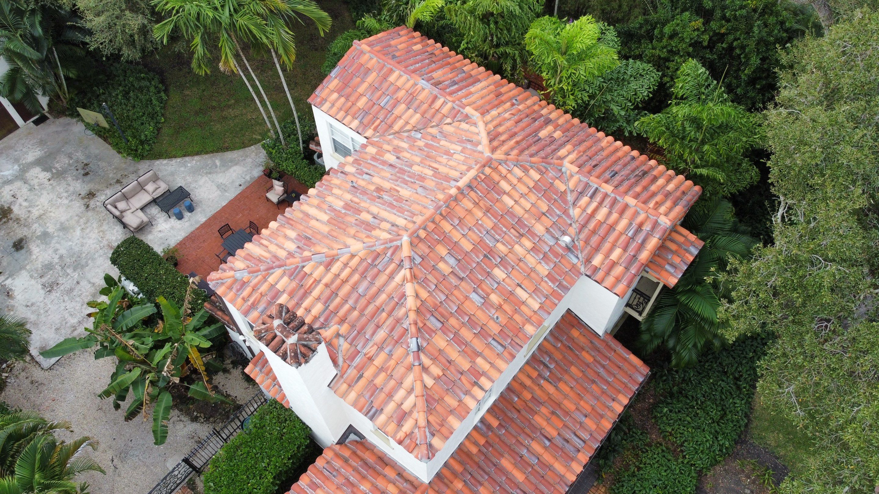 Residential Roofing Installation using Two Piece Clay Barrel Tile with a mortar set application by BOB HILSON & CO INC