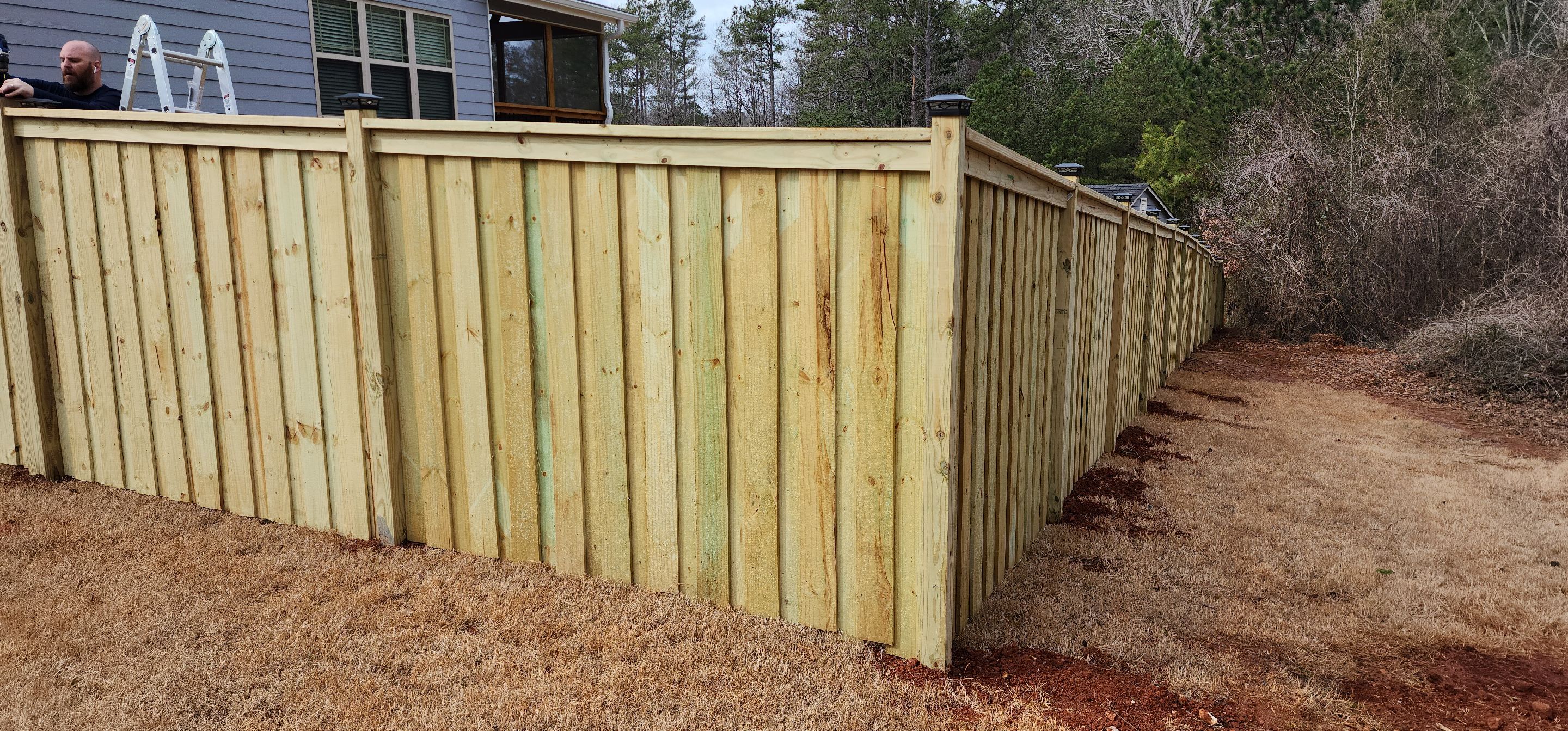 Fence Installation of Board on Board Capped Privacy by Titans of Timber Fence & Stain