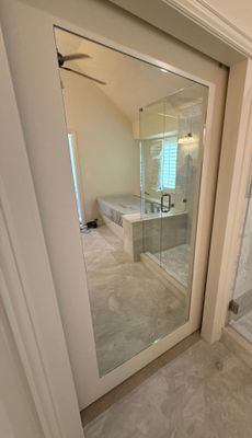 Frameless Shower and Mirror for Closet Applied to Pocket Door 