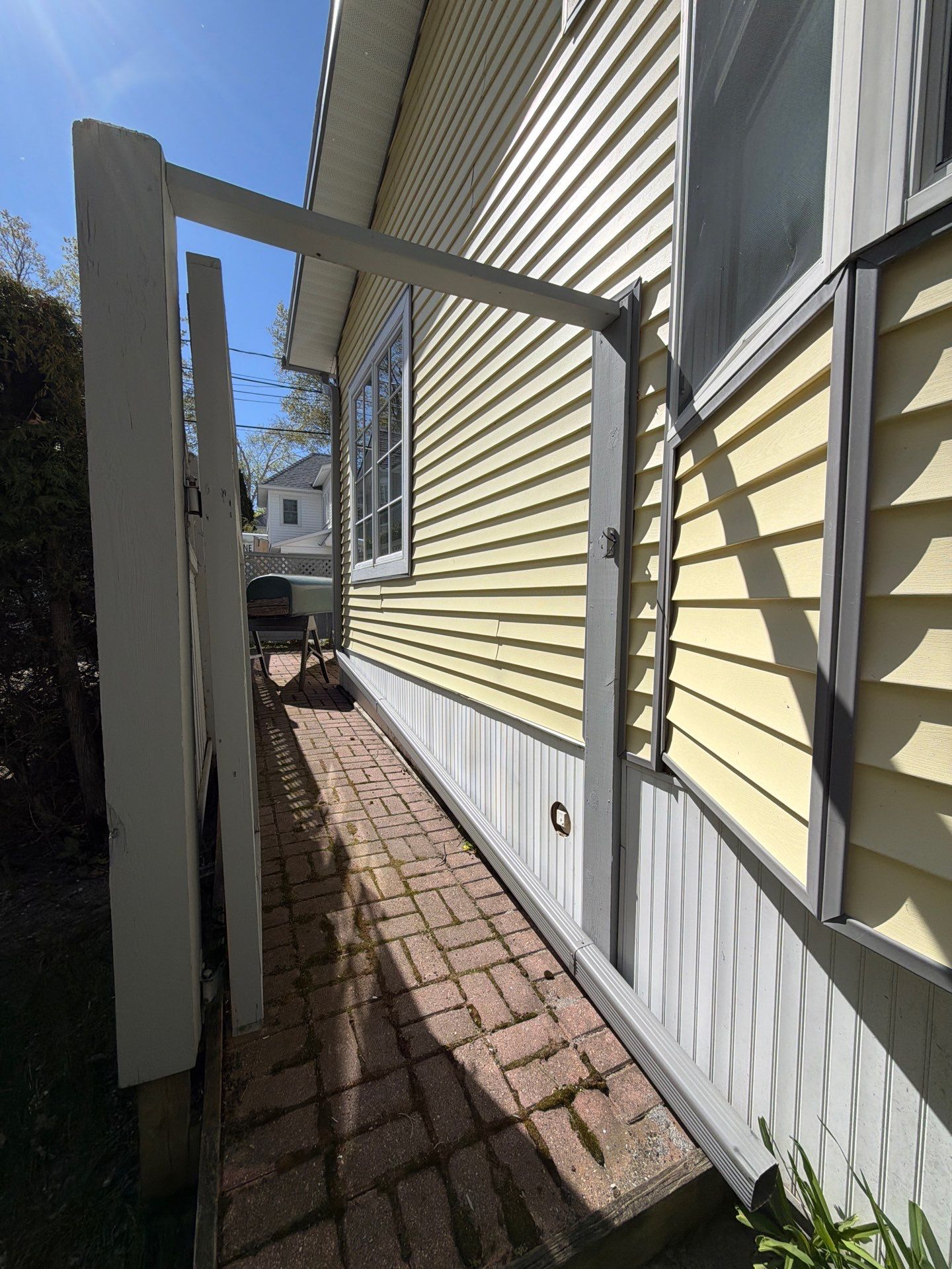 Dark Gray Aluminum Gutter System Installation in Harbor Springs by Rainbow Seamless Systems