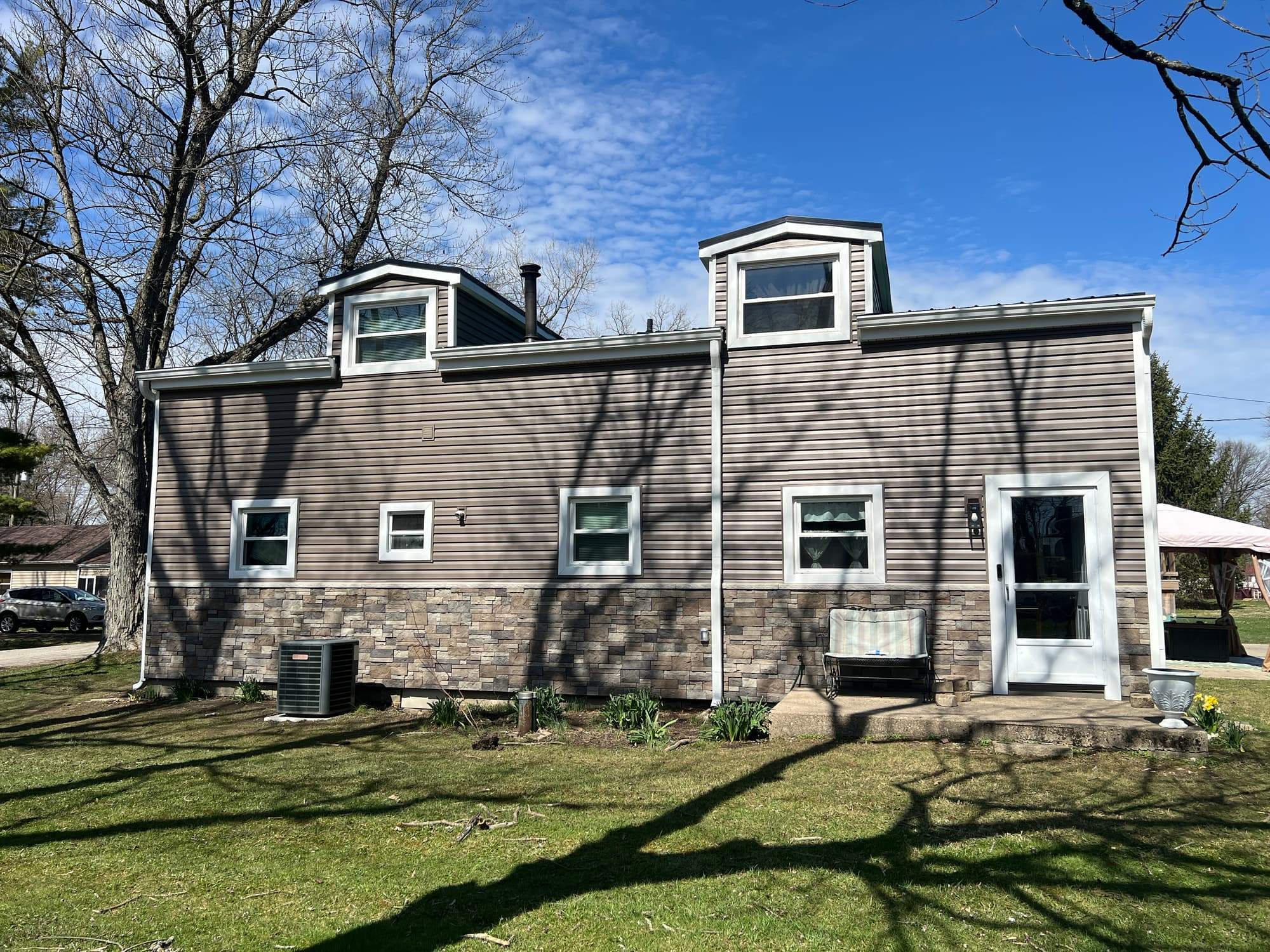 Green Metal Roof Installation and Exterior Renovation in Thornville by Canopy Contracting