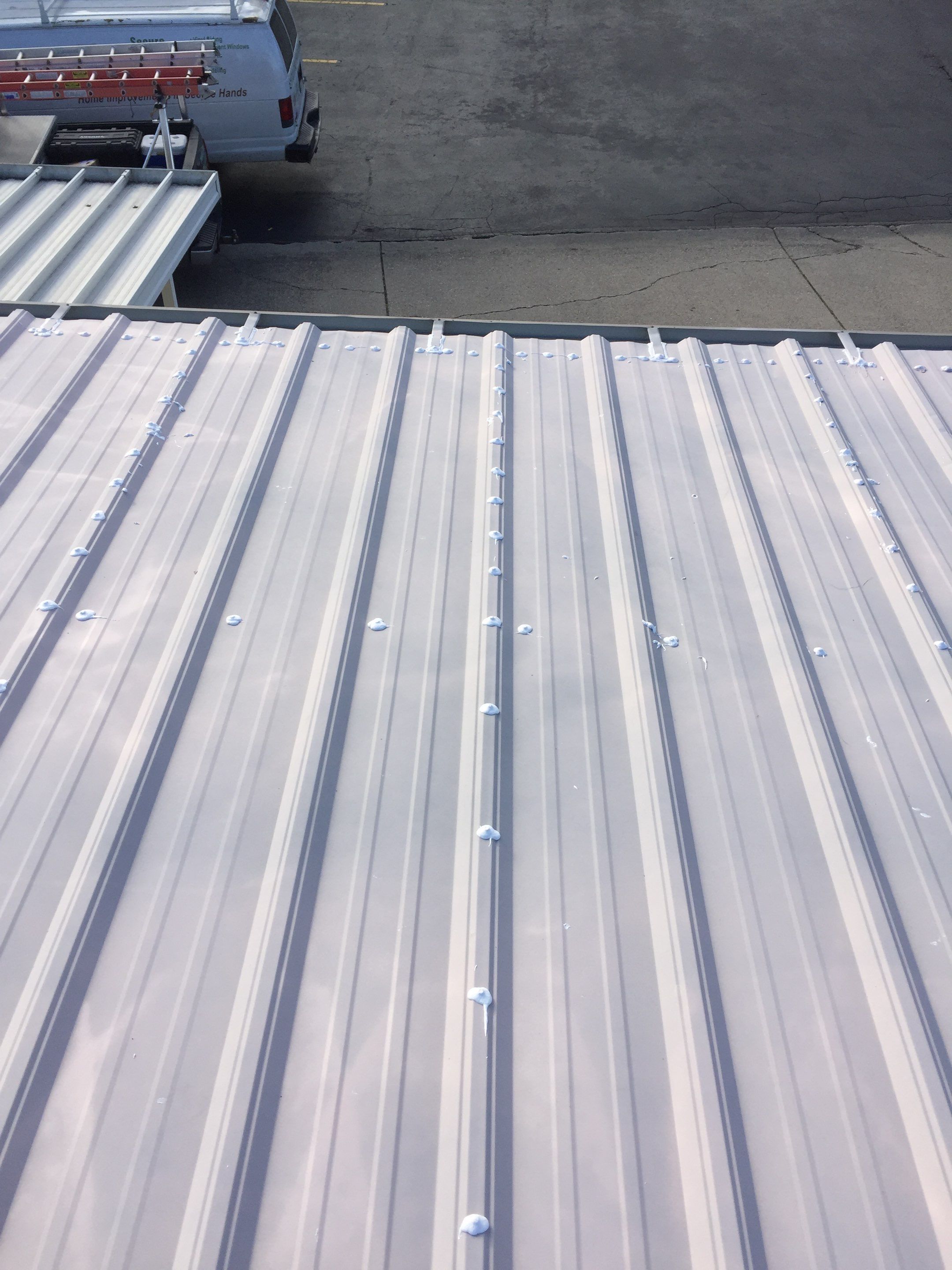 Commercial Roof Coating using Gaco Silicone Roof Coating by Secure Construction Company Inc