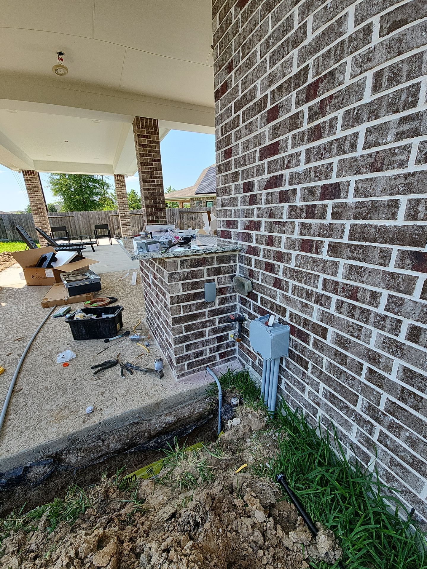 Covered patio and Summer Kitchen in Spring, TX by SophAlx LLC