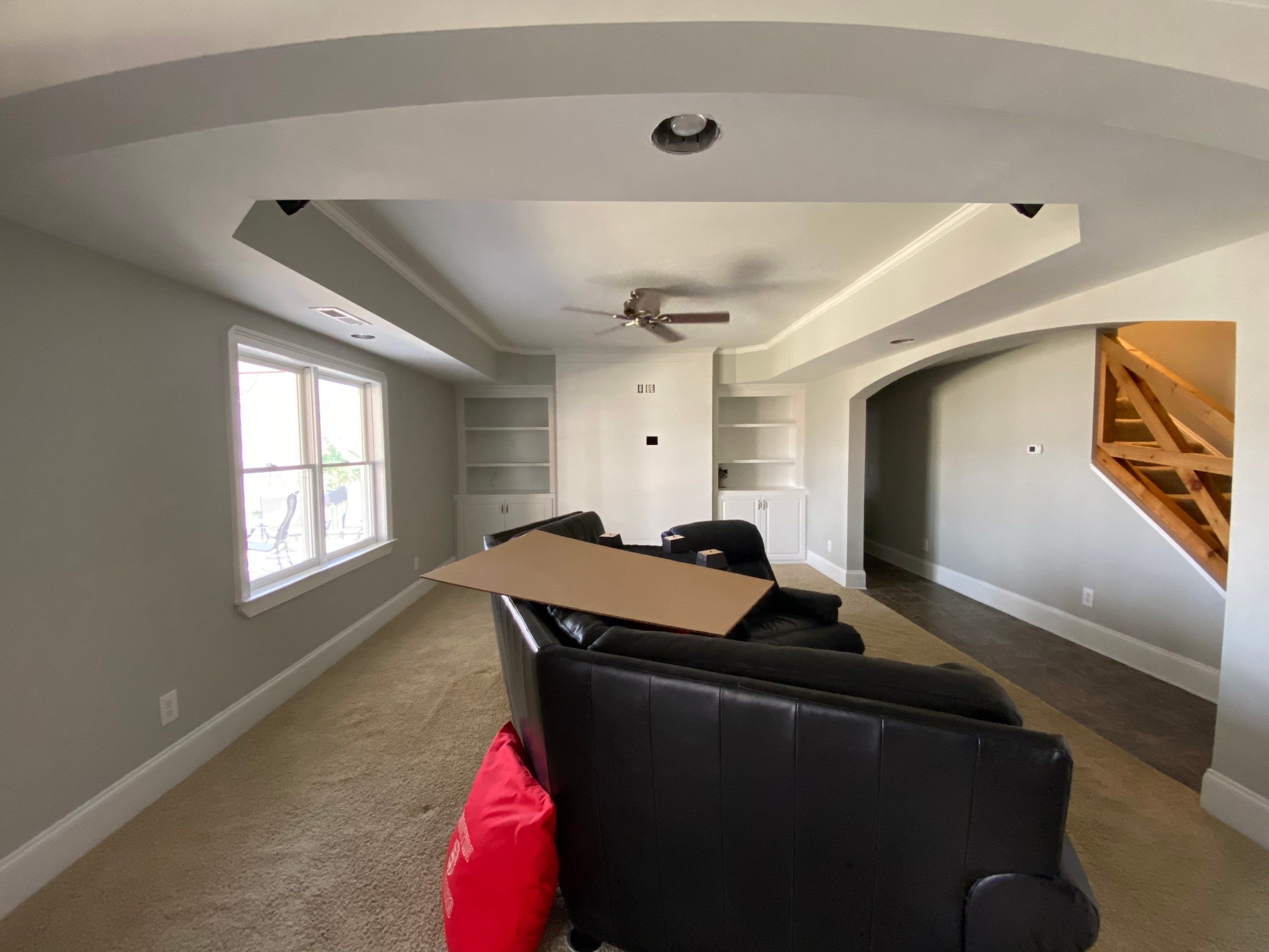Finished Basement Renovation with Custom Shiplap and Modernized Wood Railings by Swift Home Renovations 