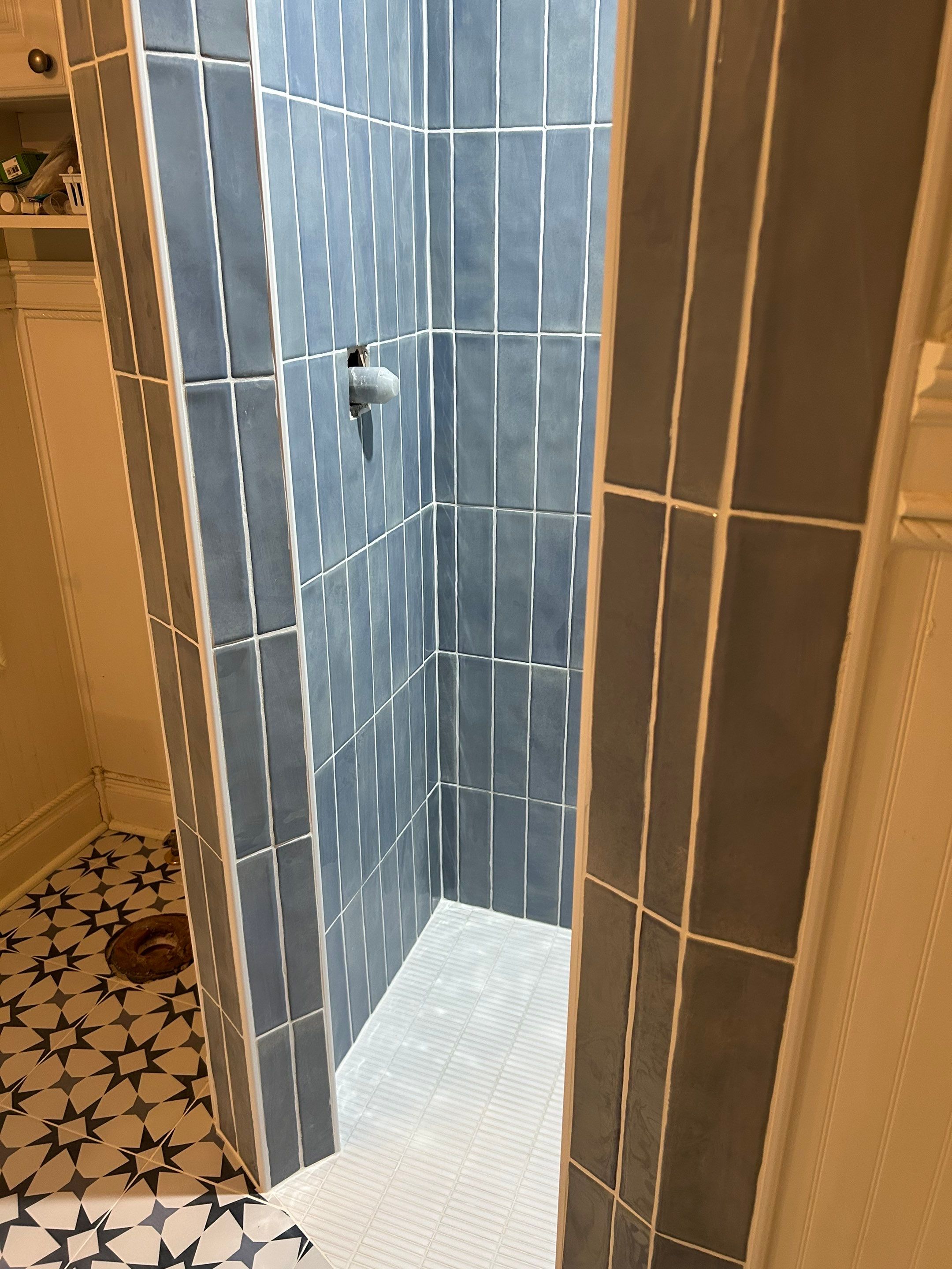 Tile shower and floor by Footprints Floors of Nashville