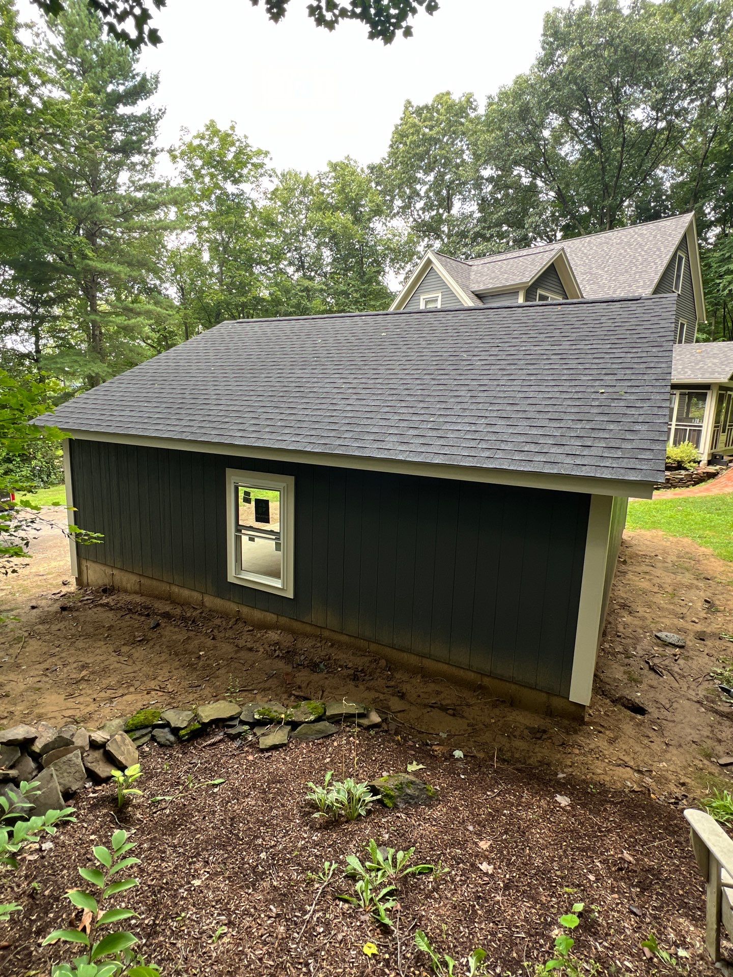 Garage using LP SmartSide Panel Siding by Chagnon Building & Remodeling LLC