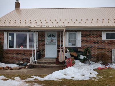 Tan Metal Roof and Gutter Replacement for Valley View Home
