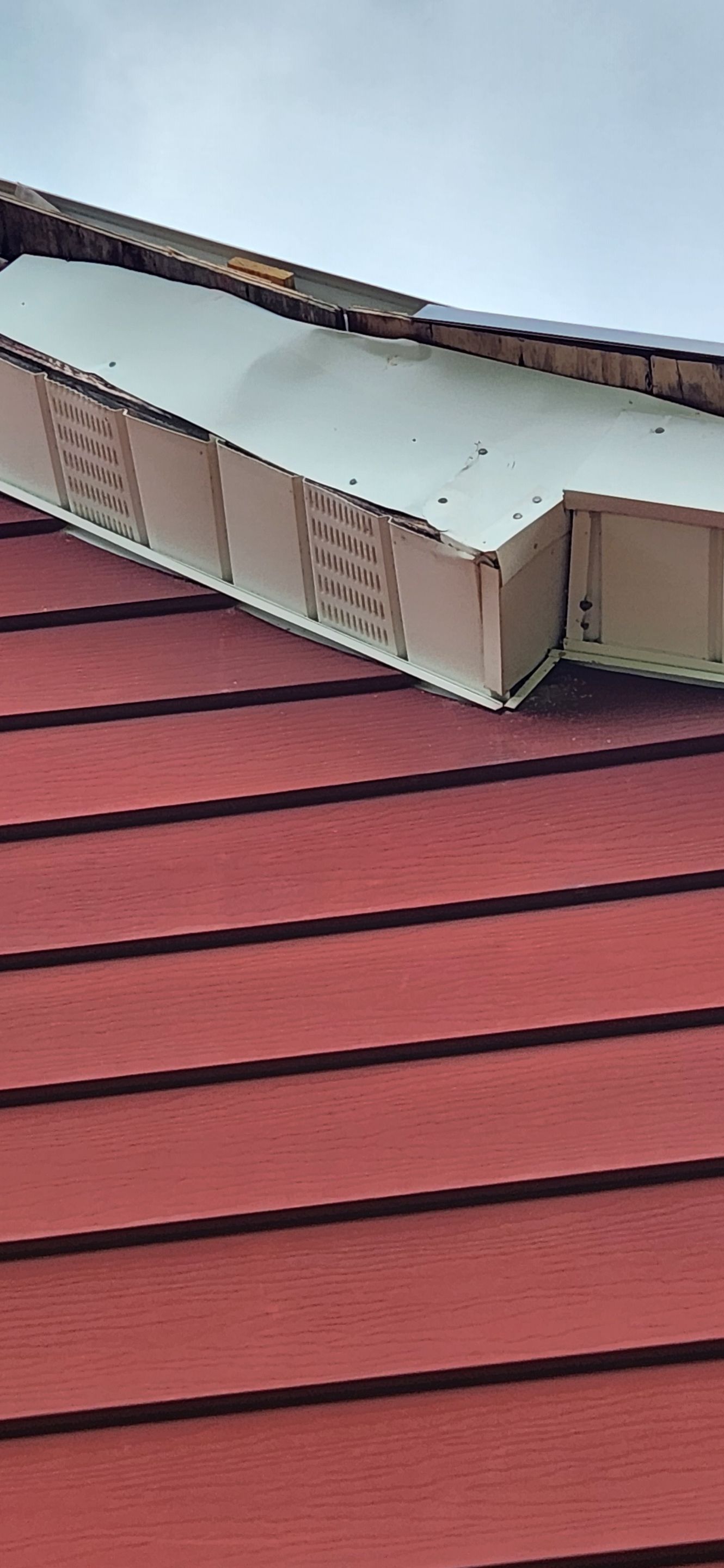 Residential Roofing Installation using 26 Gauge Colored Panels by Hostetler Roofing