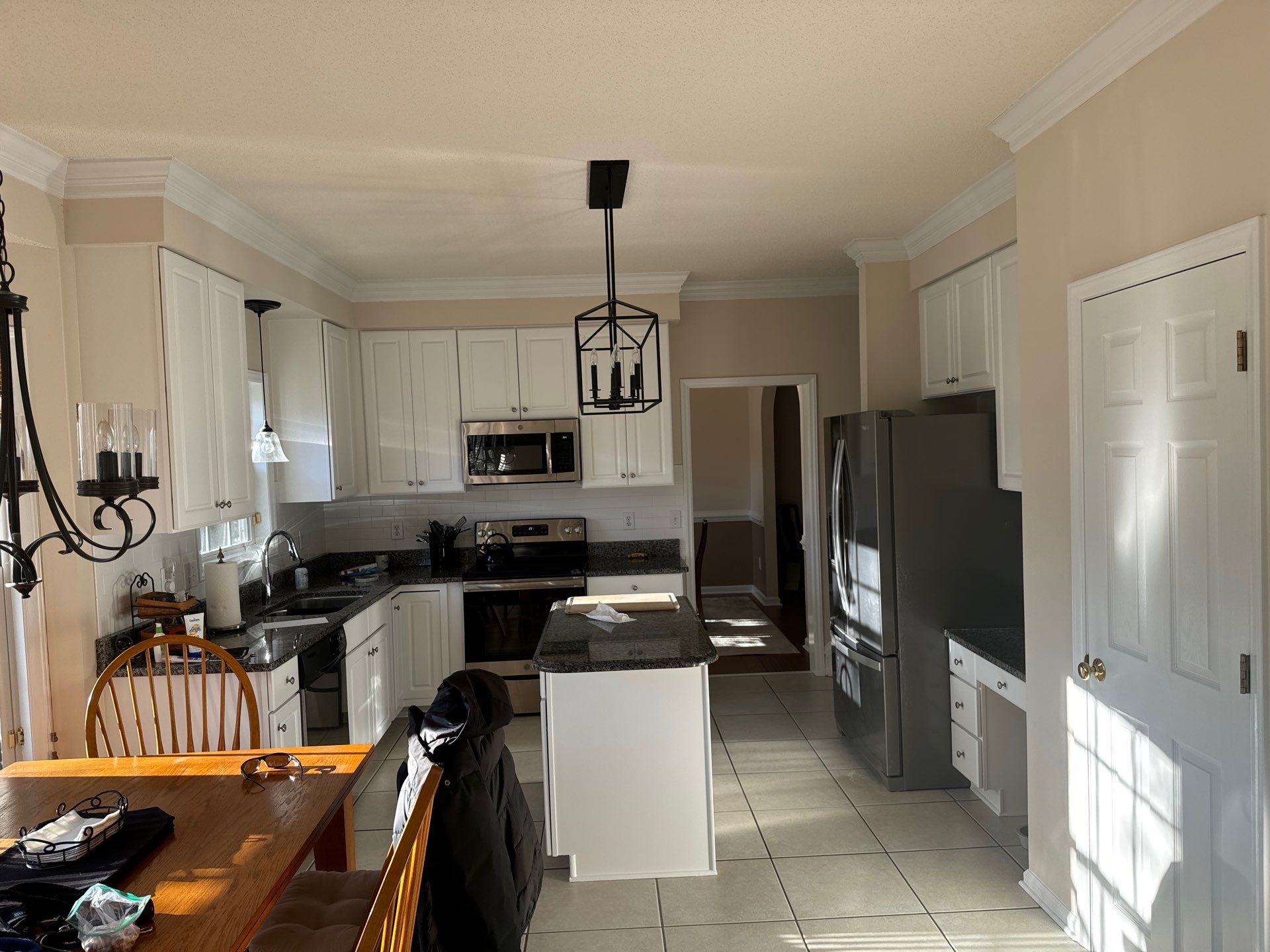 Cabinet painting by GonzalezPainters & Contractors Inc 